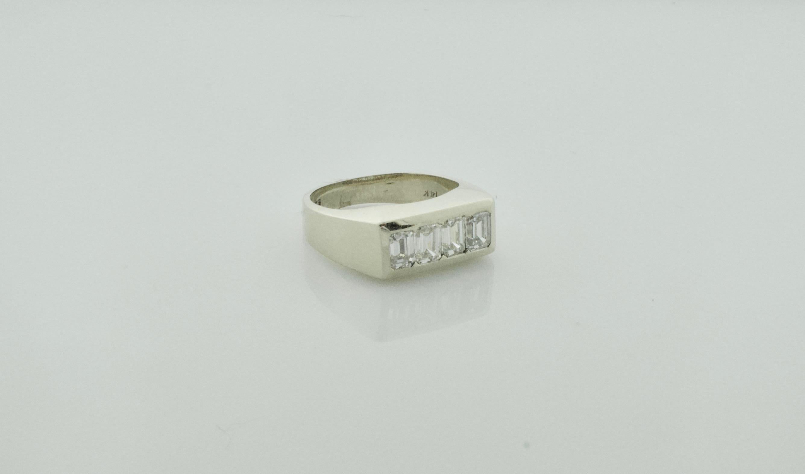 1940's Diamond Ring 1.20 Carats of Emerald Cuts
This is a Delightful Non-Gender Conforming Ring 
Four Emerald Cut Diamonds Weighing 1.20 Carats Approximately [GHI- VVS-VS1] [bright with no imperfections visible to the naked eye]
Currently Size 6.5