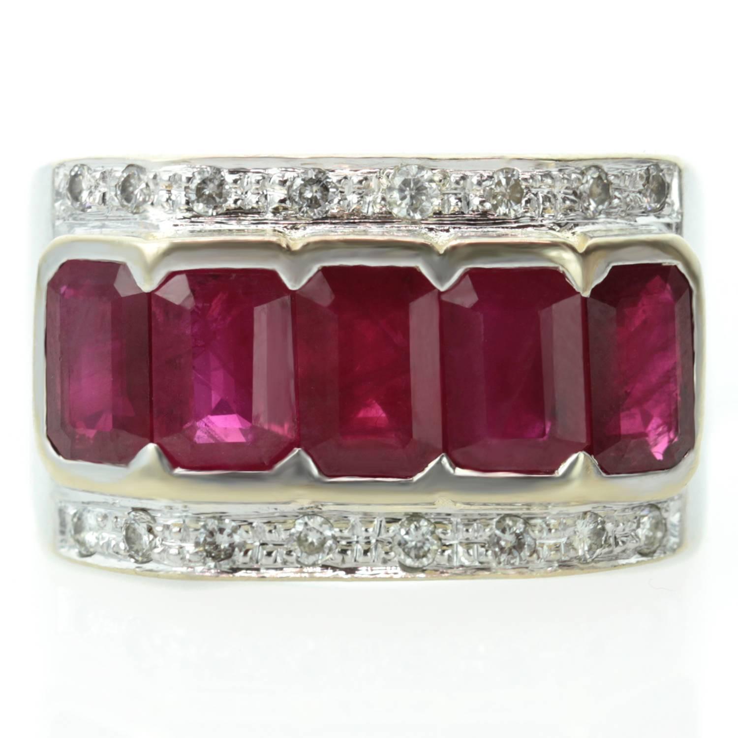This stylish retro band is made in 18k white gold and features 5 emerald-cut 4.0mm x 6.0mm rubies set yellow gold and surrounded by sparkling round diamonds. Measurements: 0.47