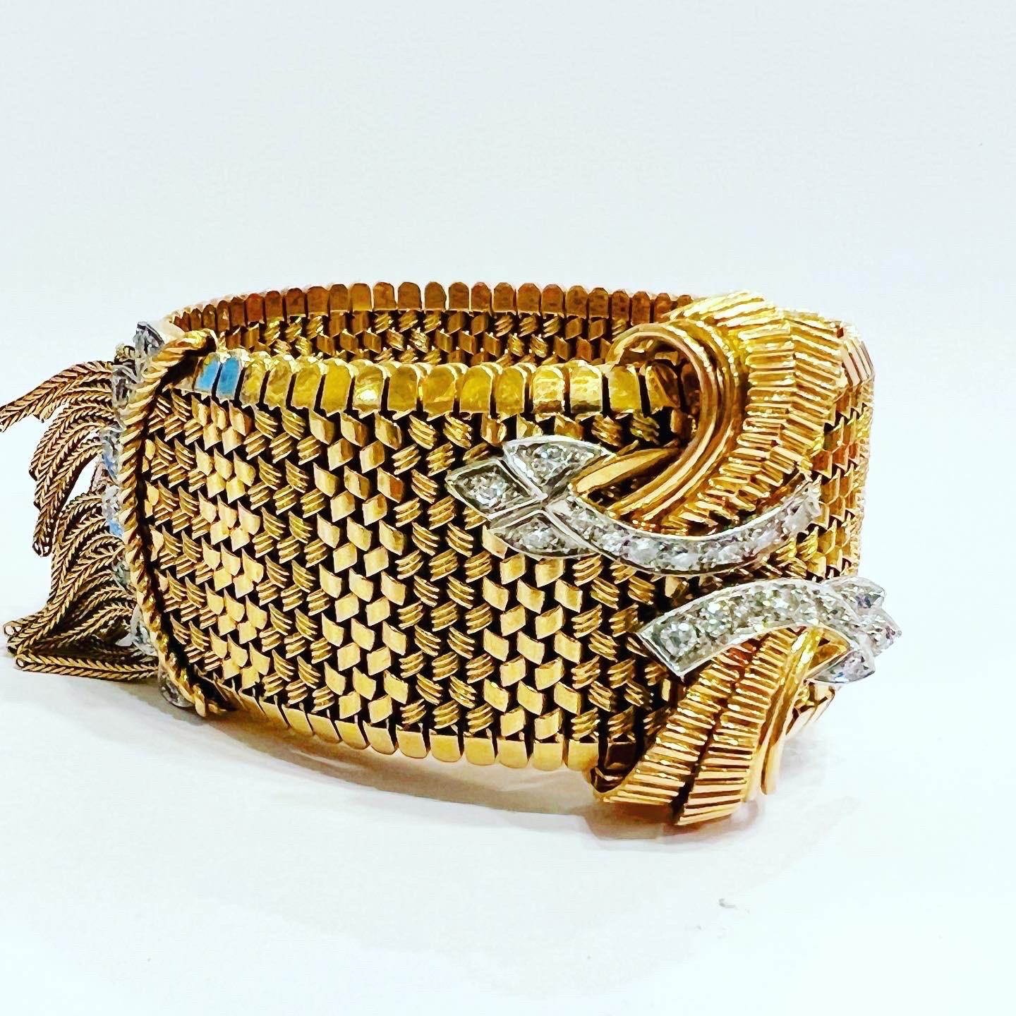 1940s diamonds and 18k yellow gold platinum mesh adjustable retro bracelet.
Captivating with its details and a brilliant buffed luster, this adjustable bracelet secures with a pull out buckle clasp, where it acts almost like a belt.
French