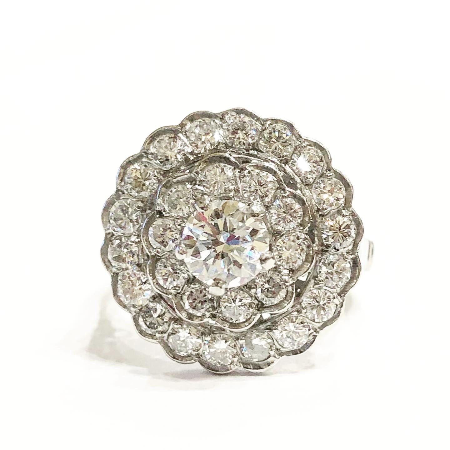 Double halo platinum diamond engagement ring with central stone.
France, circa 1940. Condition: Good..
Brilliant-cut diamonds.
Total approximate diamond carat weight: 1.98 carat: central stone 0.68 carats + 1.3 carats.
Height: 2.5 cm Width: 1.7 cm