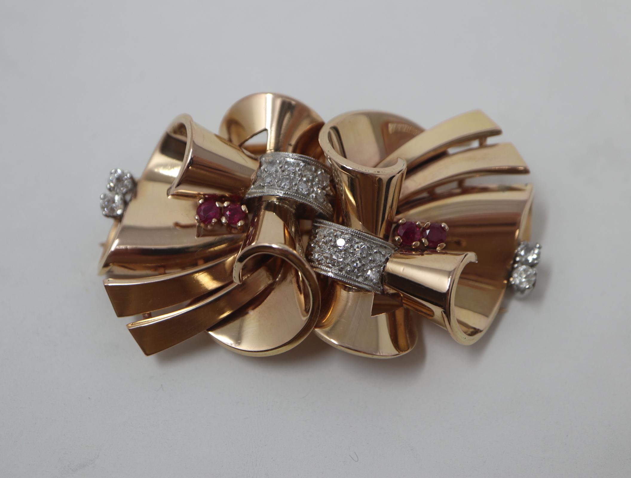 1940'S Dress Clips Rubies and Diamonds Convertible to Brooch 14K Rose Gold

31.58 Pennyweight

16 Diamonds: G-H, SI2, Single Cut, 0.32CTW

4 Rubies: Round Faceted, 0.50CTW