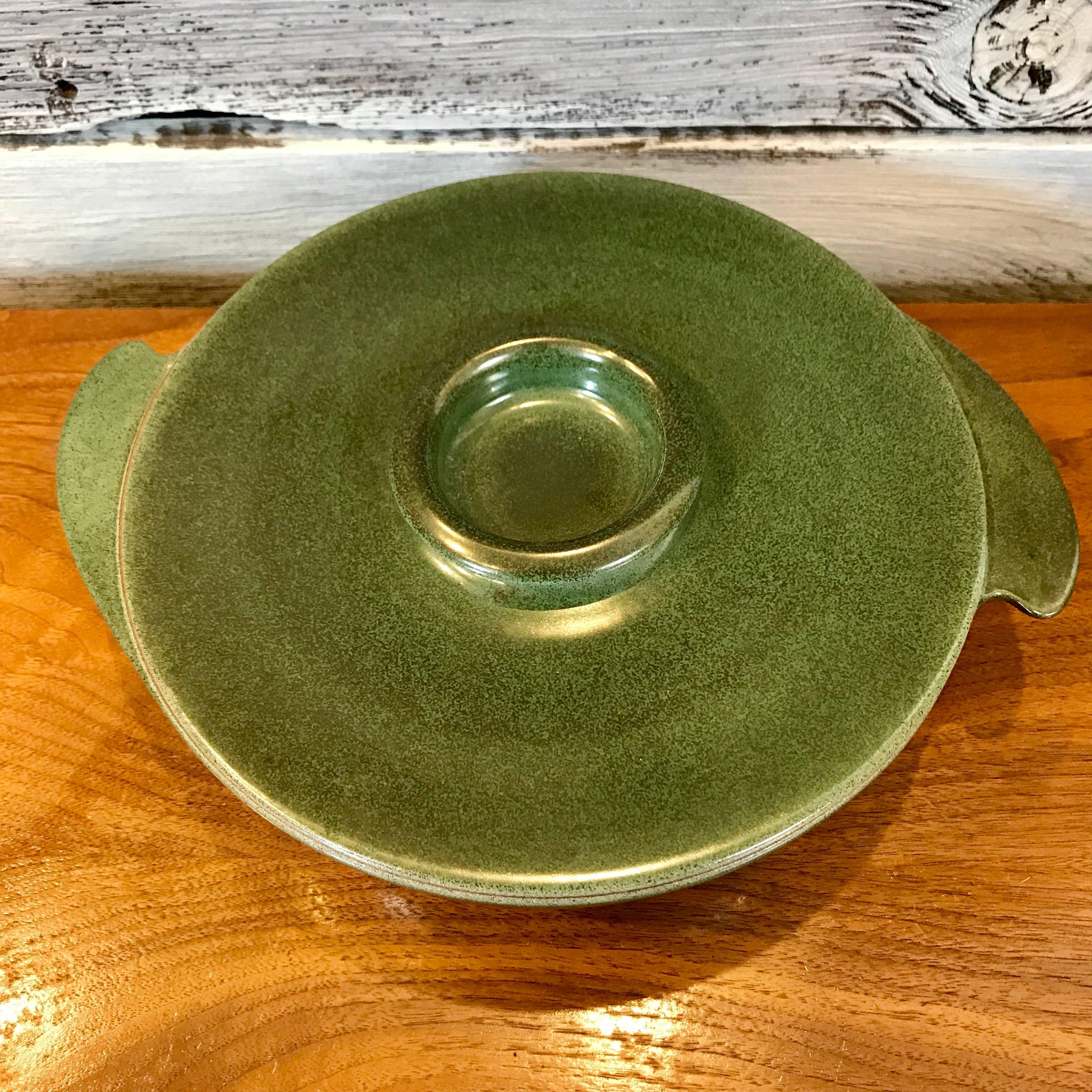 1940s winged covered serving bowl/casserole by Edith Heath for Heath Ceramics of Sausalito, California. An early Heath design, with two wings on the side of the bowl and early Heath markings on the underside. Metallic green glaze, in excellent