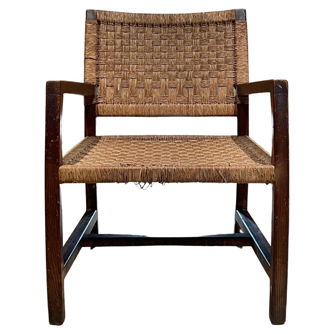 Armchair
1940s Easy armchair style of Clara Porset Mexico in red pine wood seagrass rope
Preowned unrestored vintage condition. Slight damage front of seat. 
Original patina and wear visible on wood. 
Review images provided.
Measures: 30.75