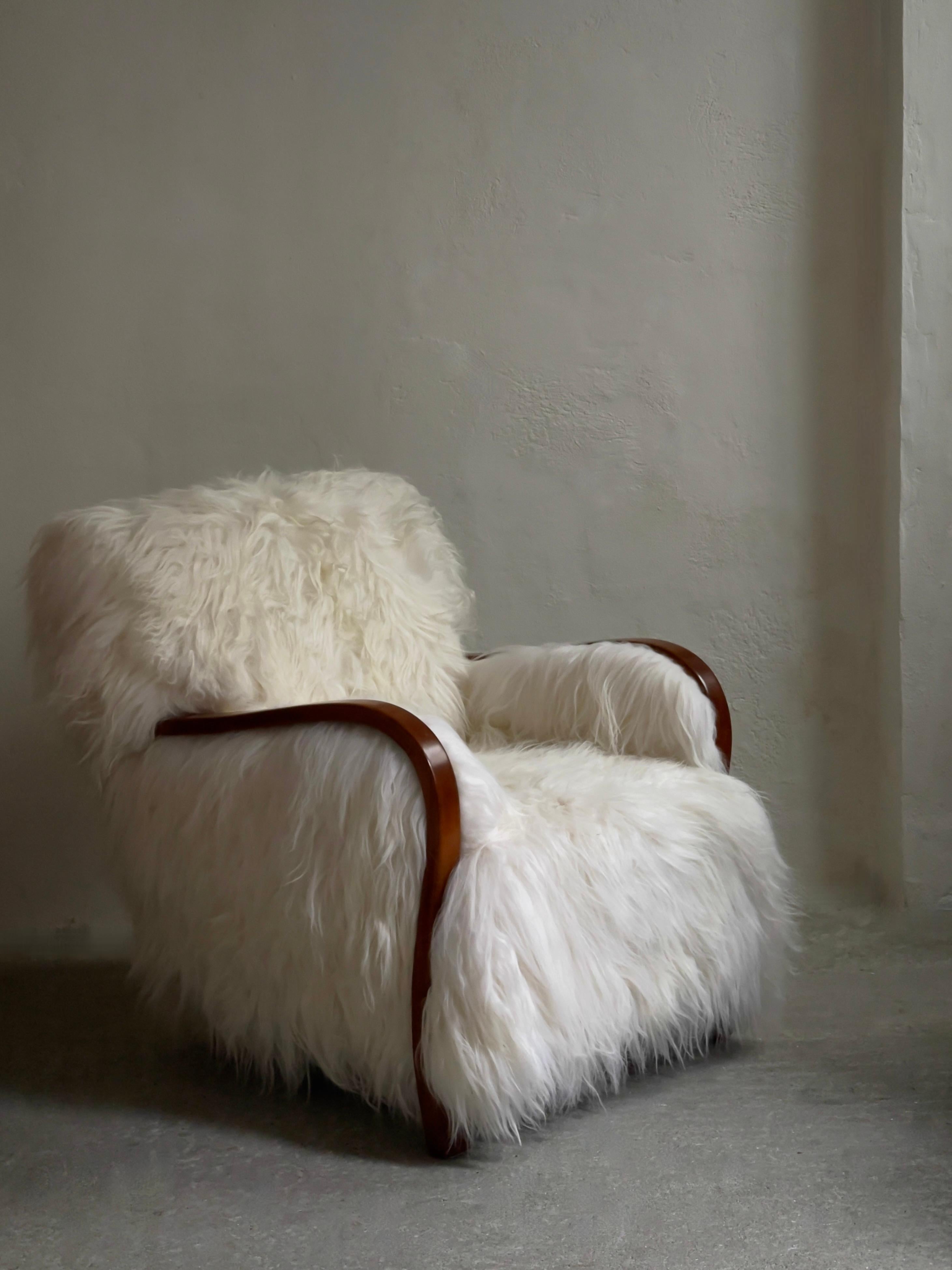 1940s Danish Lounge chair reupholstered in long haired Icelandic sheepskin. For Sale 1