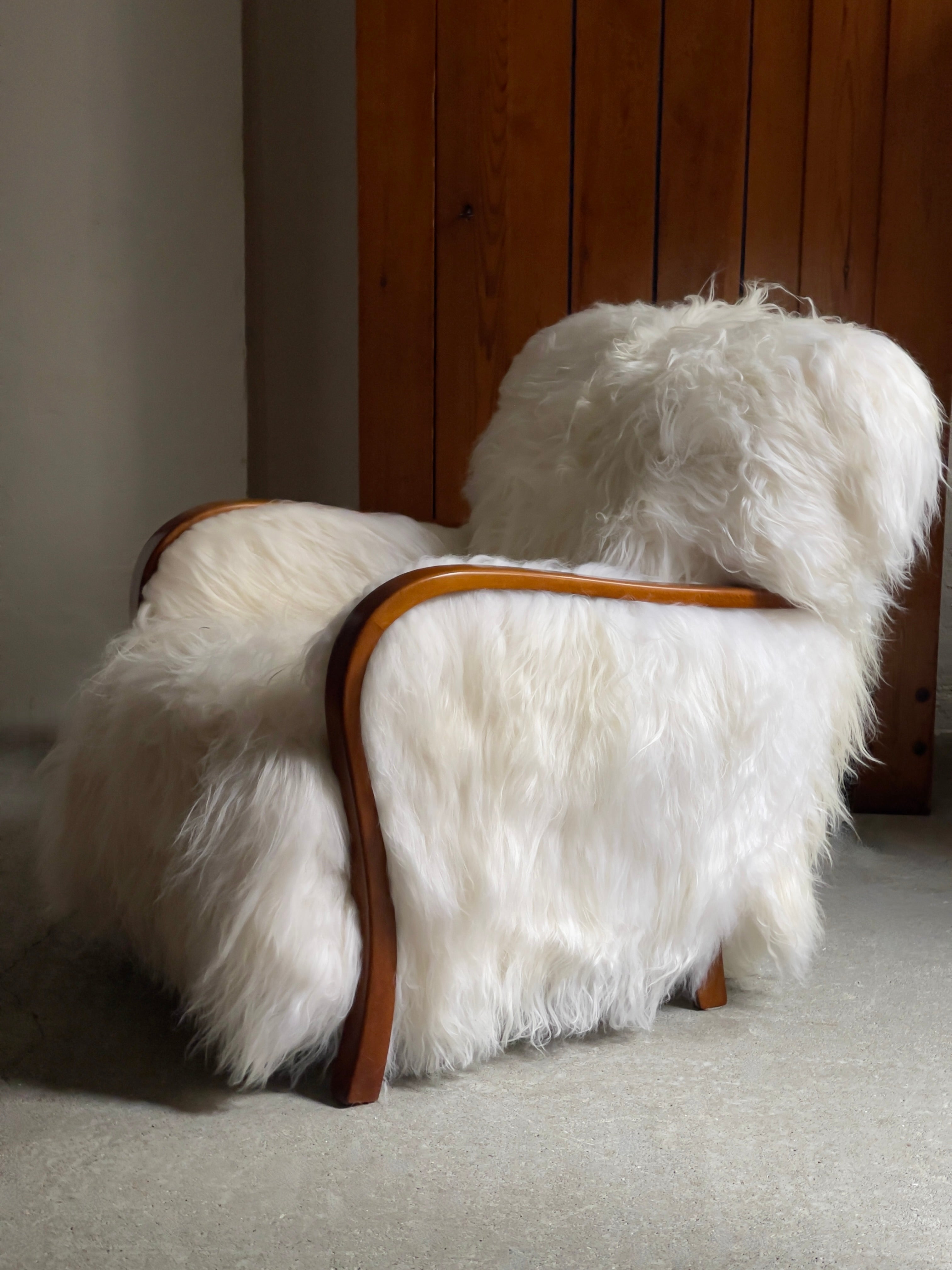 Mid-20th Century 1940s Danish Lounge chair reupholstered in long haired Icelandic sheepskin. For Sale