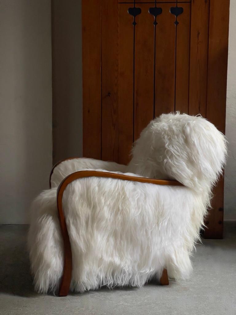 1940s Danish Lounge chair reupholstered in long haired Icelandic sheepskin. For Sale 4