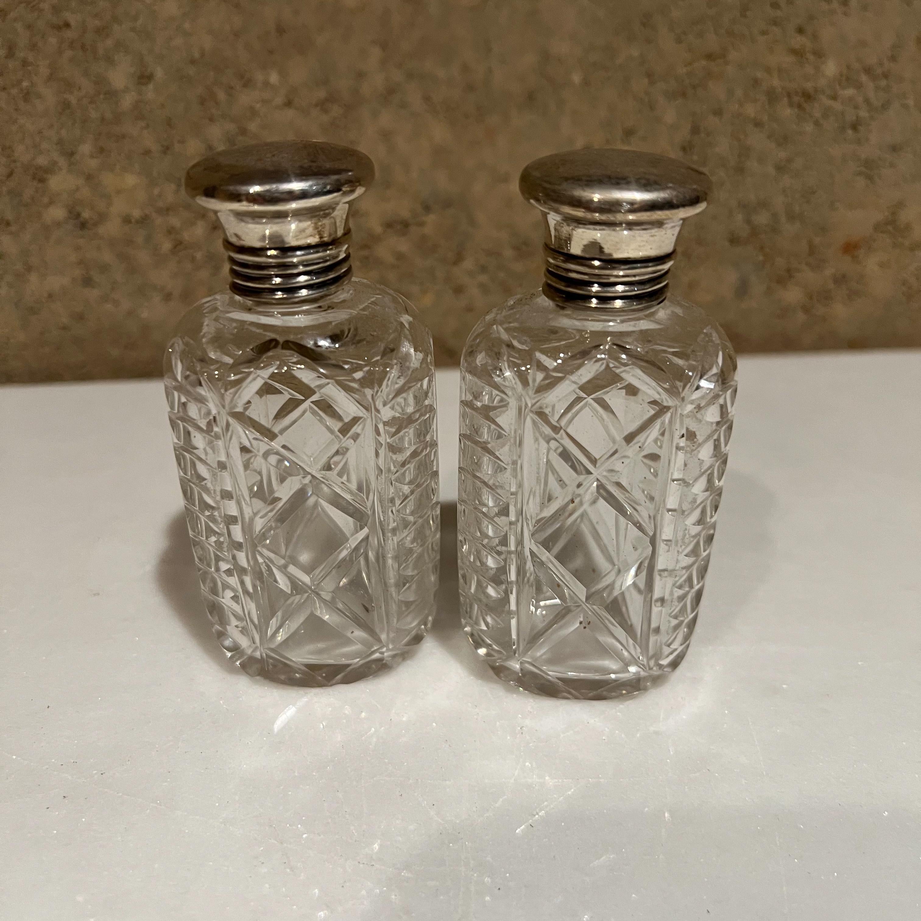 Antique glass jars
1940s Elegant vintage vanity bottle jars in cut-glass with silver-plated bottle caps.
Set of two
Measures: 3.75 tall x 2 width x 1.25
Preowned original unrestored vintage condition.
See images provided.
  