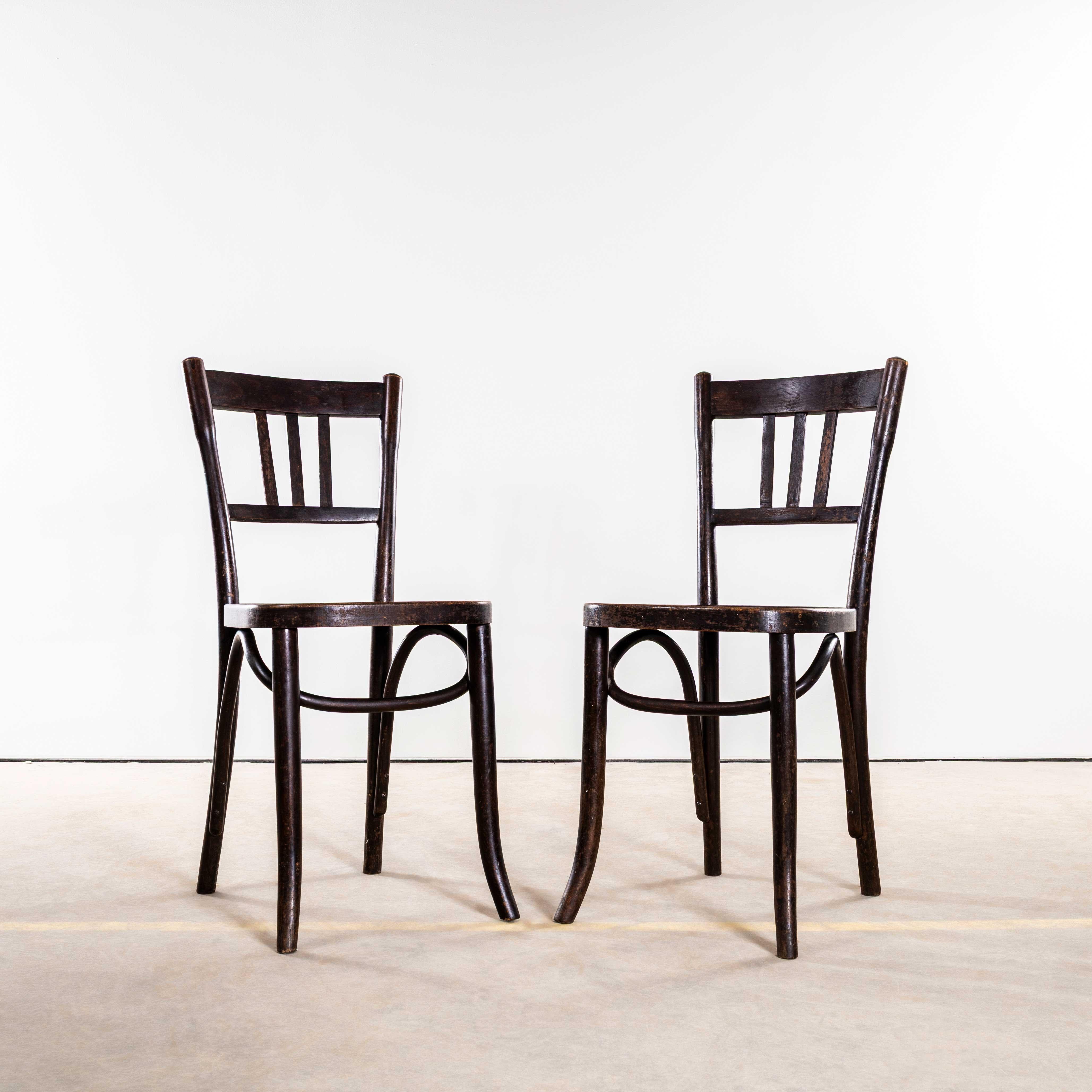 1940’s Elegant Dark Oak Bentwood Thonet Dining Chairs – Pair. 
Founded in the early 19th Century by Michael Thonet, Thonet invented the process of steam bending wood under pressure and used this to design the classic bentwood chairs still in