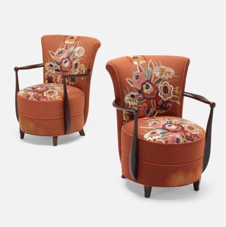 Pair of 1940s French slipper chairs. Hand-embroidered floral design with stained beech accents. Minor wear on upholstery consistent with age and use. 