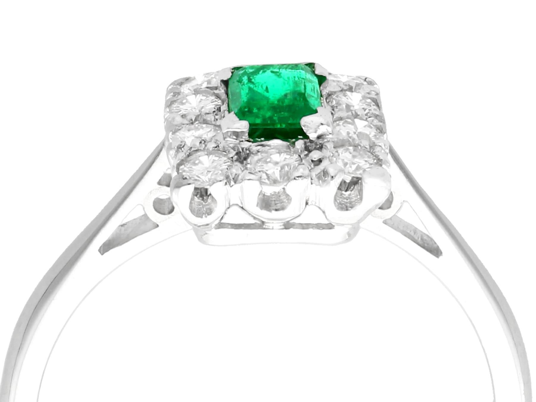 A fine and impressive 0.28 Carat emerald and 0.30 Carat diamond, 18 karat white gold cluster ring; part of our diverse vintage jewelry collections

This fine and impressive vintage emerald and diamond cluster ring has been crafted in 18k white