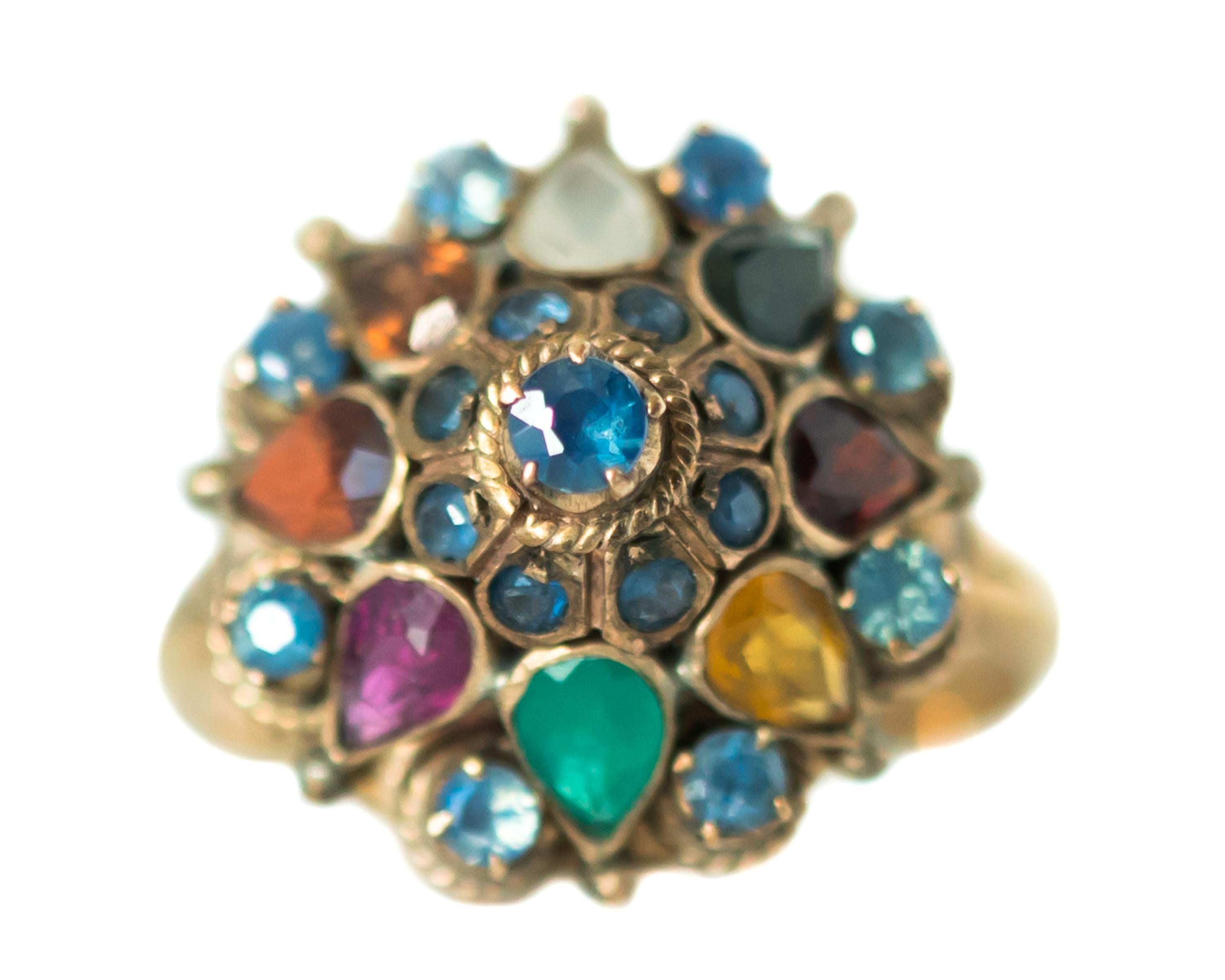 1940s Retro Gemstone Dome Ring - 14 Karat Yellow Gold, Emeralds, Sapphires, Citrine

Features: 
Dome Style
14 Karat Yellow Gold Setting with a Rosy Patina
Round Prong Set Sapphires
Pear Shaped Bezel Set Emerald, Citrine 
Cathedral Setting
Swirl