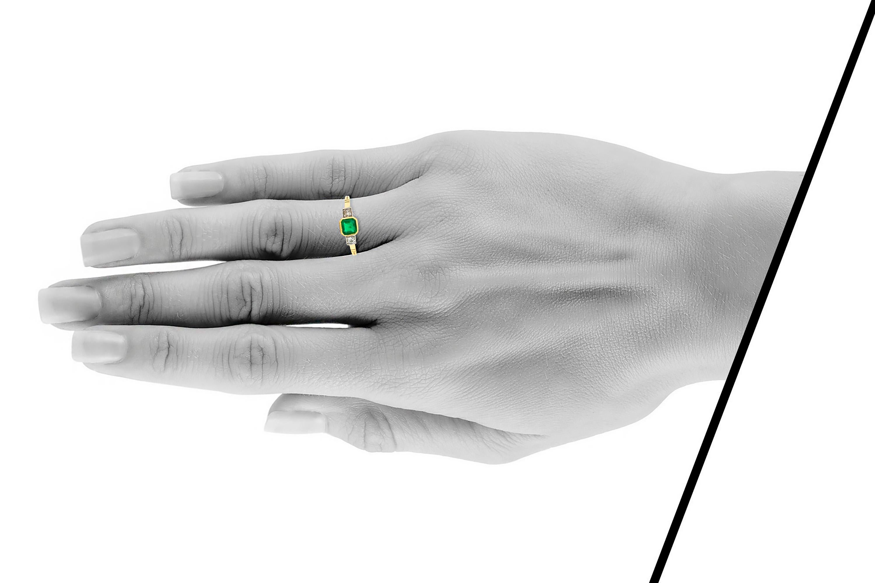 emerald ring with side diamonds
