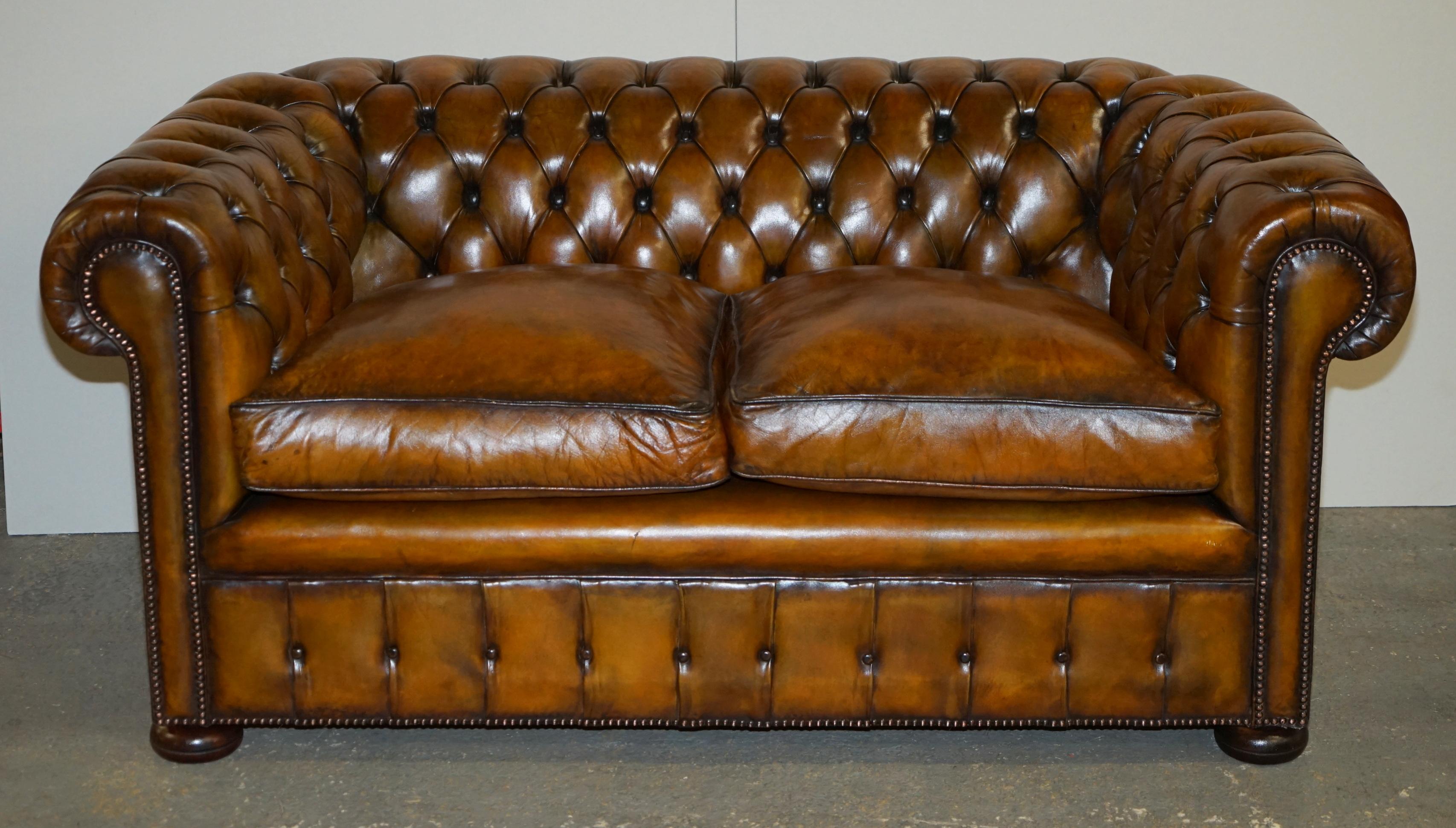 Royal House Antiques

Royal House Antiques is delighted to offer for sale this exceptionally rare original 1940’s Whisky brown leather Chesterfield club sofa in newly restored condition with feather filled cushions.

Please note the delivery fee