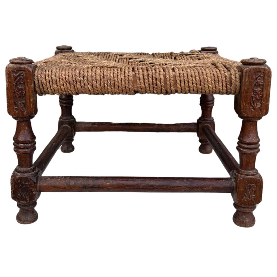 Circa 1940s England. 

With complementary tones of the wood and jute, this large vintage ottoman/stool is perfect to add some warmth to your home. We love this placed in the living at the end of a cozy chair, by the fireplace with a stack of books