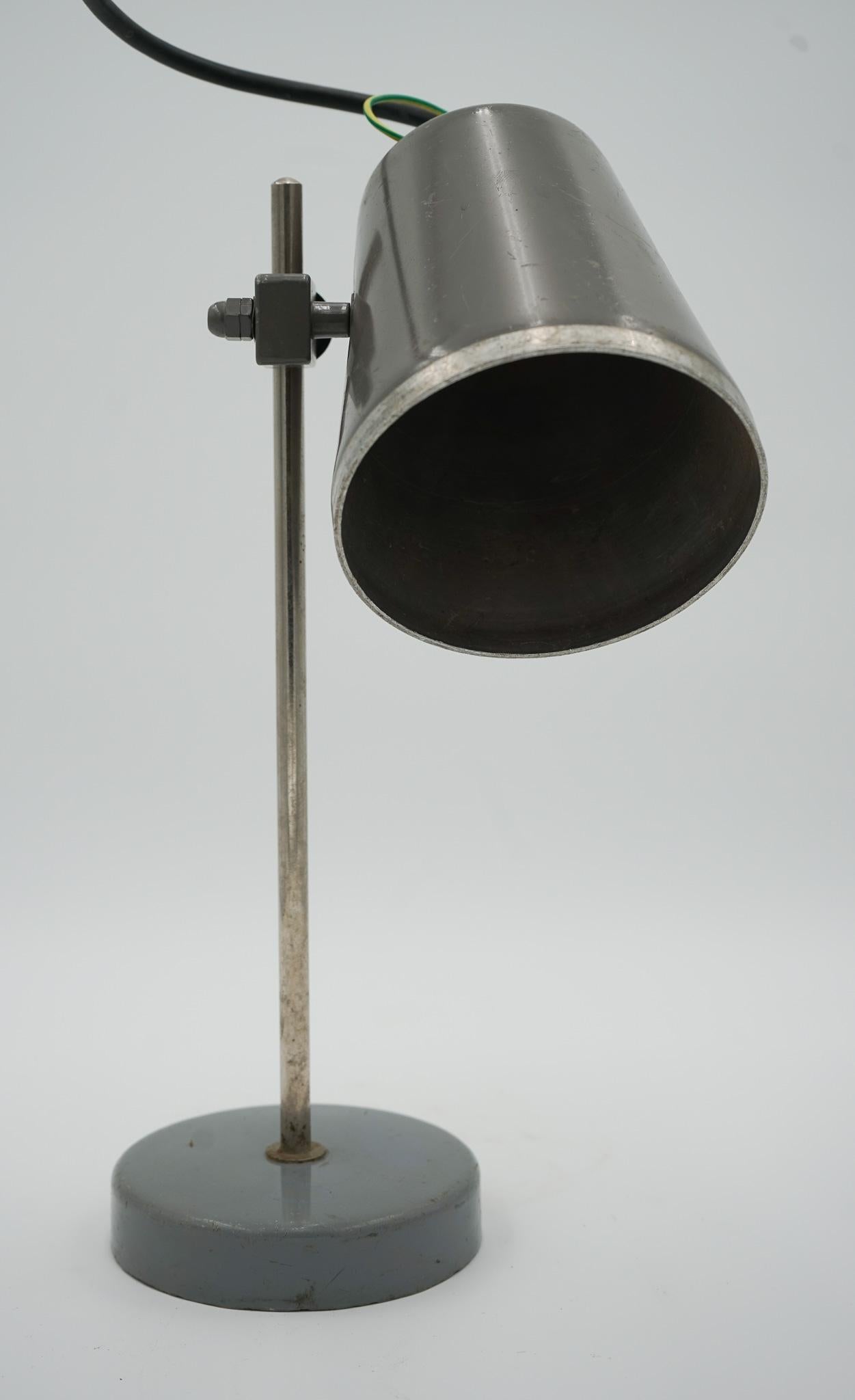 

We are delighted to offer for sale this 1940s English Salvaged Laboratory School Lamp Is A Remarkable Piece.

 This lamp showcases the charm and industrial design of its era. The lamp features a natural patina that tells a story of its past, with