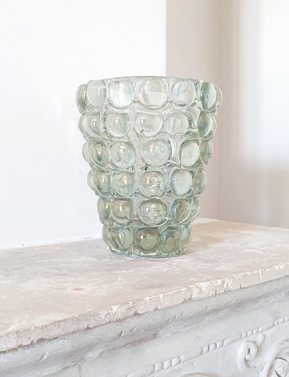 Ercole Barovier became known for his thick-walled vessels decorated with un-melted pigments, textured and ball-like surfaces, raw metallic inclusions and expressive hot-work applications. Amongst his most amazing designs was the “Lenti” vase series