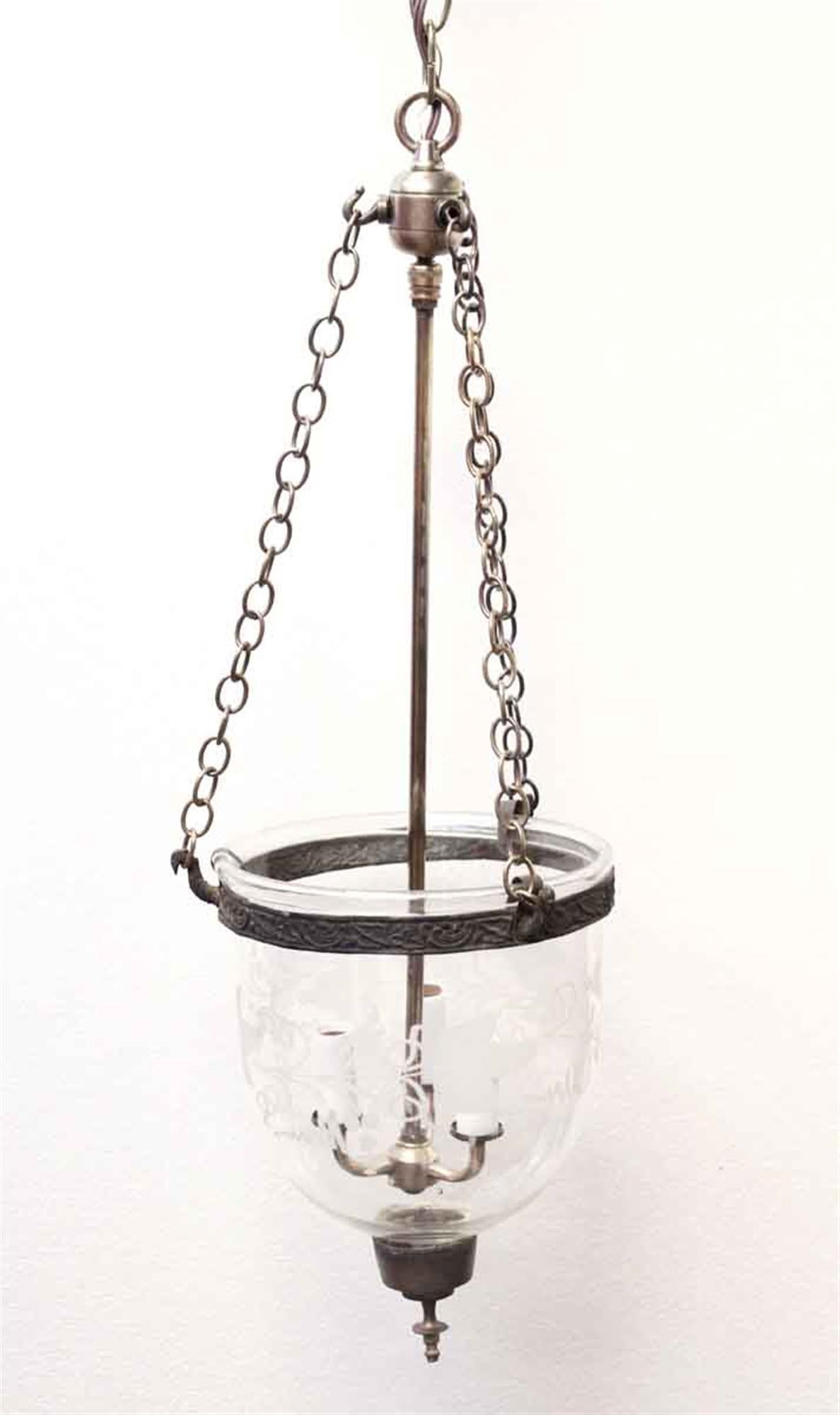 1940s hand blown crystal bell jar pendant light with fine decorative etching and three candlestick lights. This light has been completely restored with new wiring and brass hardware. The globe, trim and finial are all original. This can be viewed at