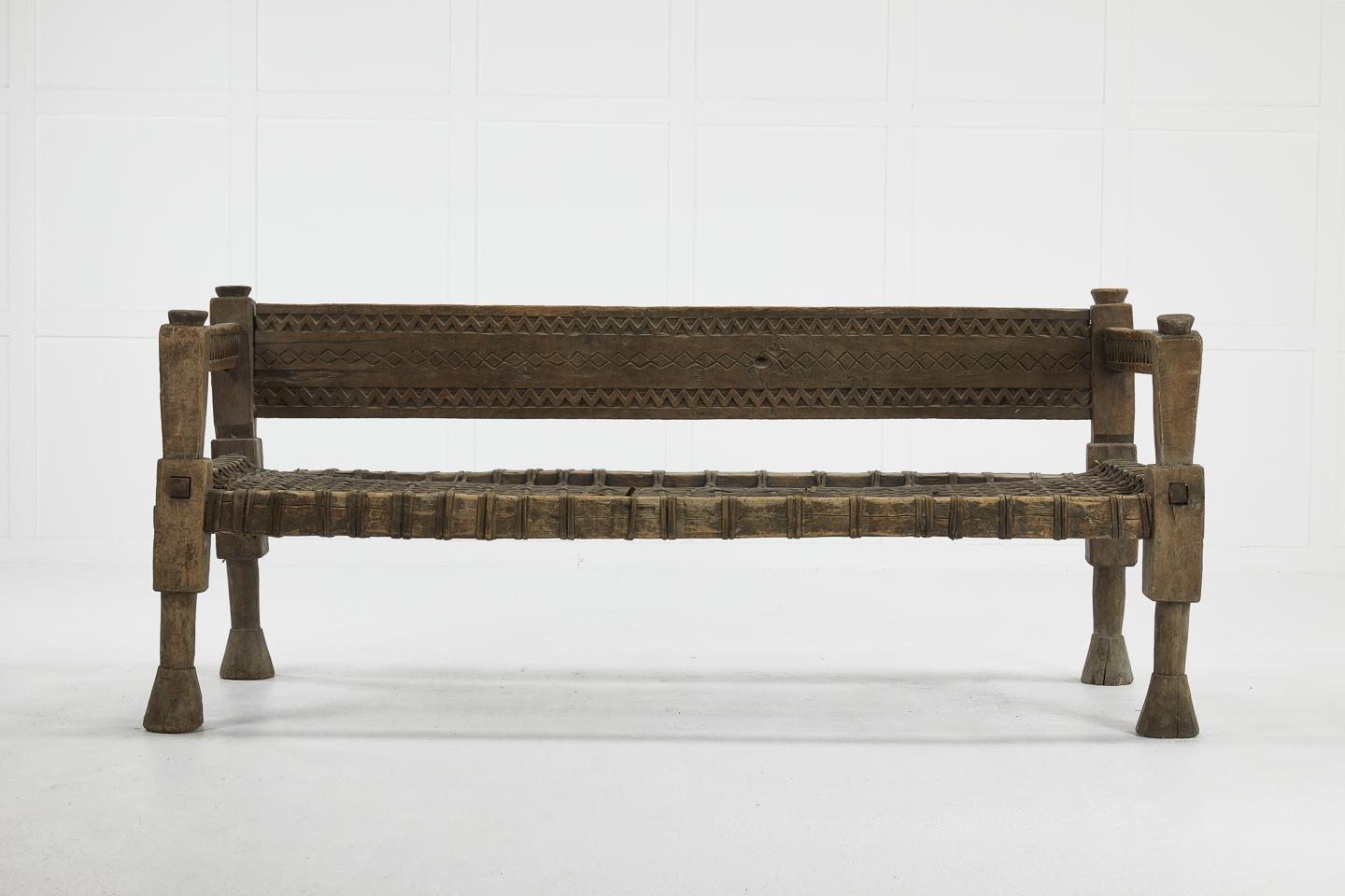 Stylish Ethiopian bench with original woven leather seat, circa 1940.

Measures: Seat height 42cm
Seat depth 64cm.