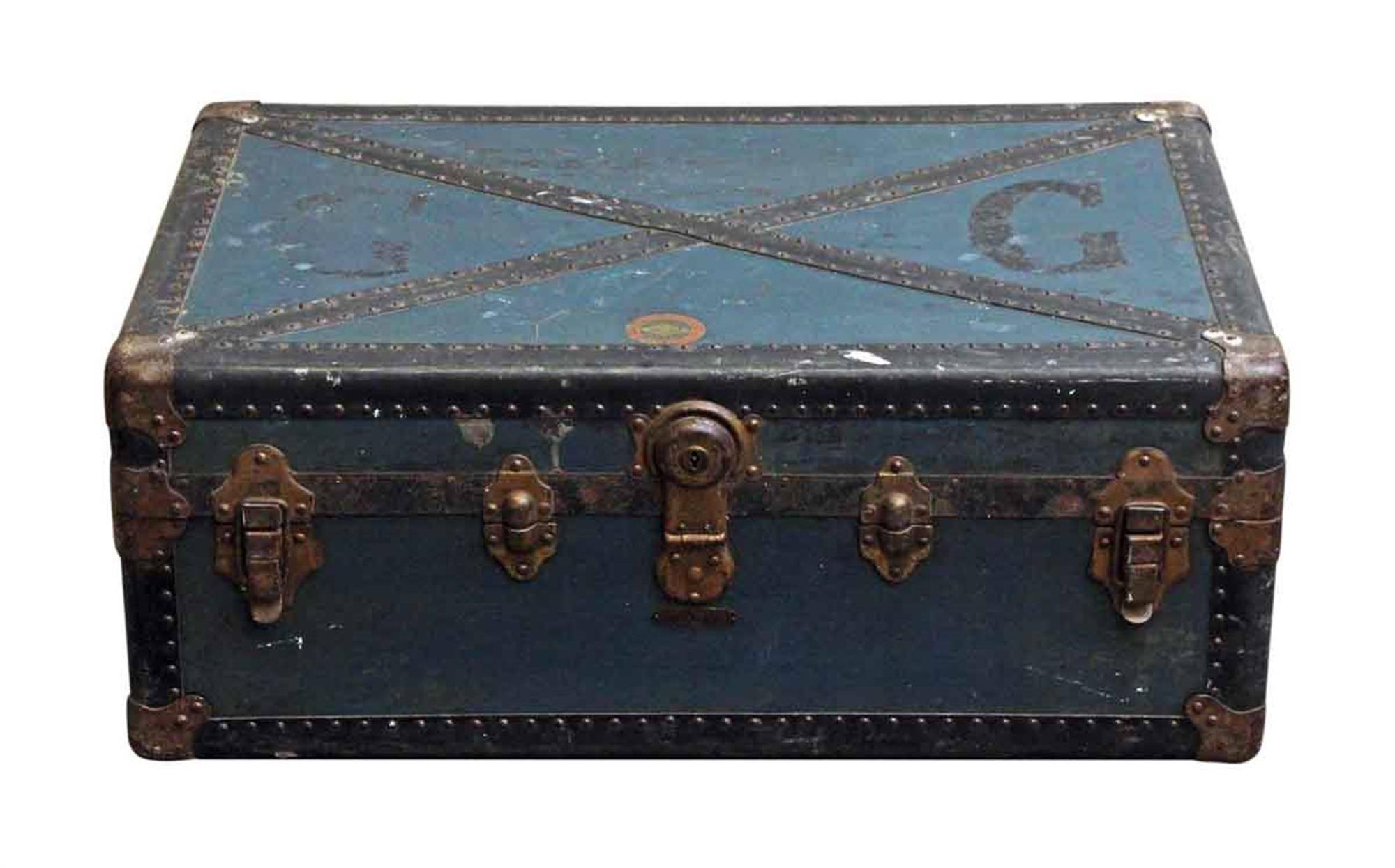 Slightly distressed vintage blue trunk from the 1940s with worn interior. Made by The Perkiomen Trunk & Bag Co. This can be seen at our 400 Gilligan St location in Scranton, PA.