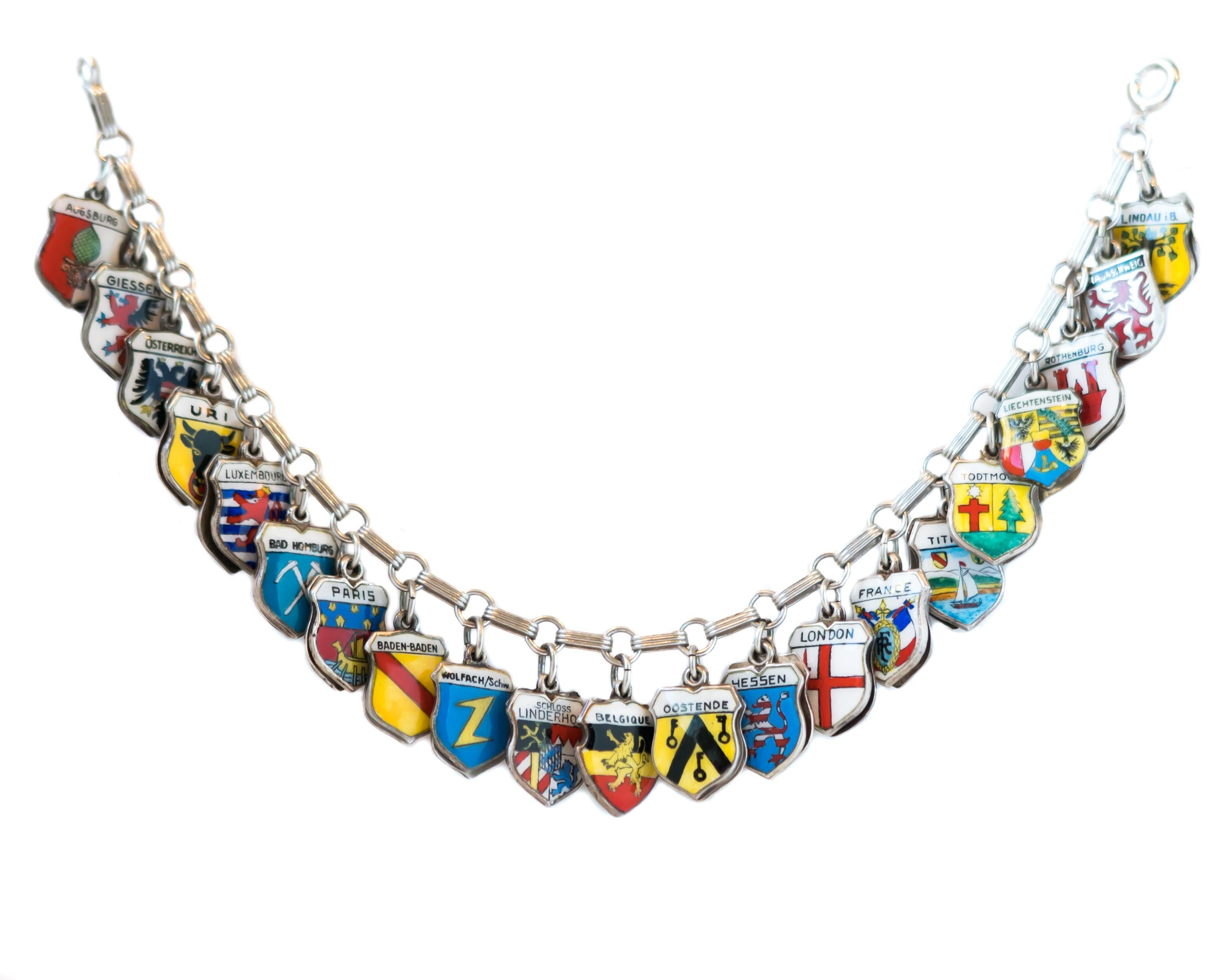 1940s Retro German, European Travel Shield Charm Bracelet - Sterling Silver and German Silver

Features:
42 Charms
Countries including Germany, Switzerland, Liechtenstein, Luxembourg, France, Belgium, Austria, Russia
Includes many German cities,