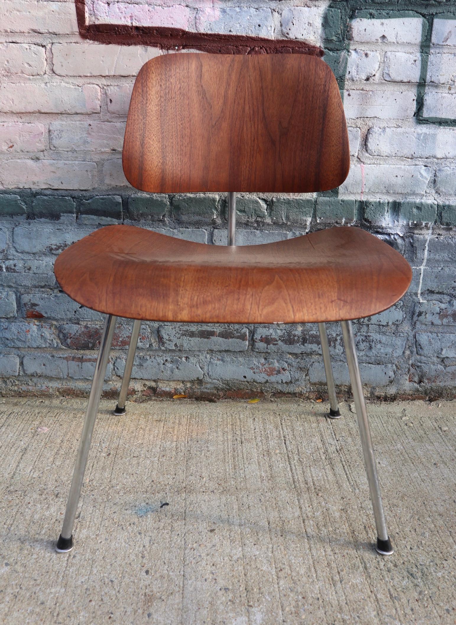 A rare and very early Eames DCM dining chair designed by Charles and Ray Eames and manufactured by Evans products in the 1940s. This is before Herman Miller took over production in 1950. The chair is identifiable as an Evans production by the