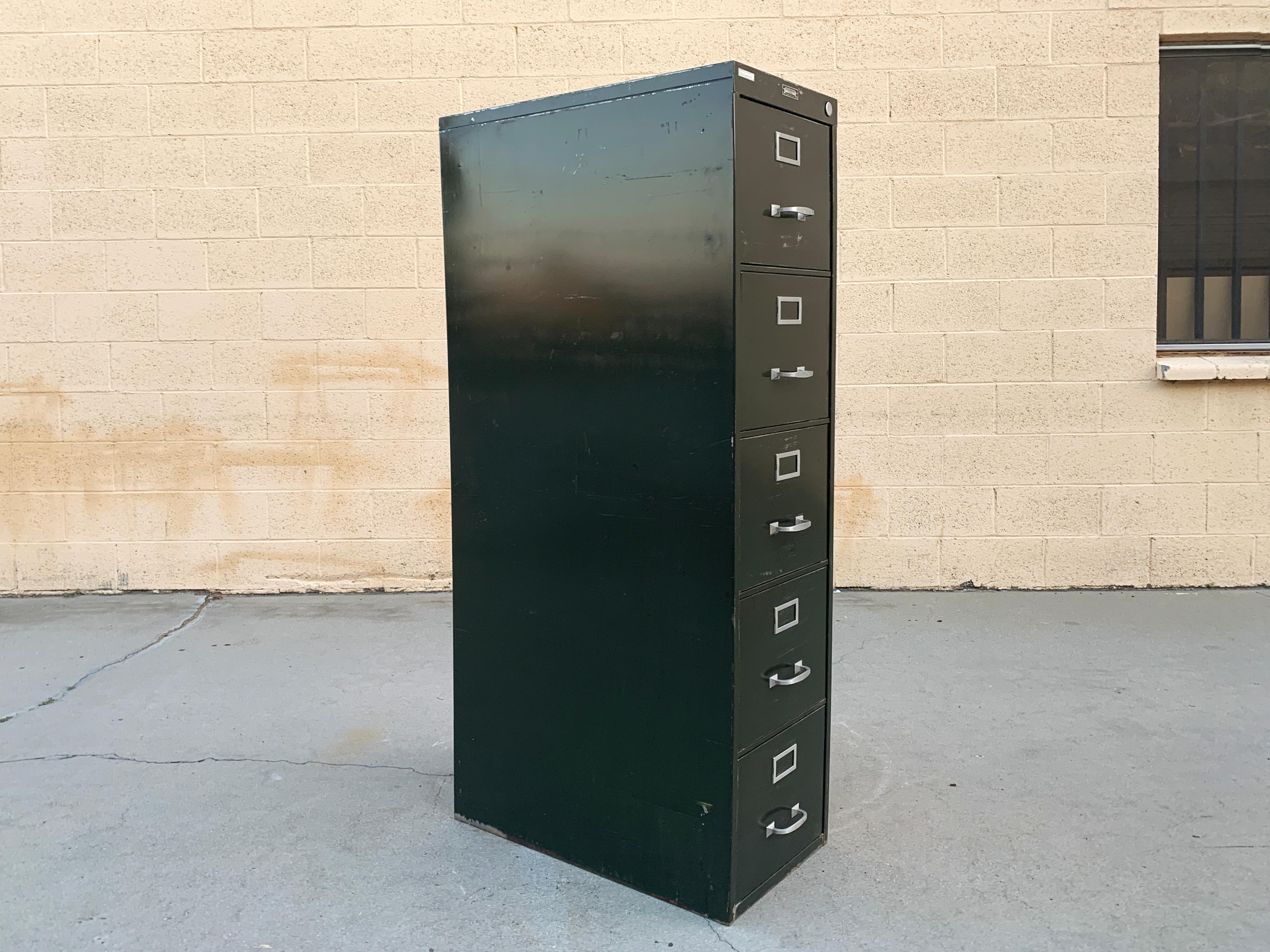1940s steel file cabinet by Steel Furniture Mfg. Co., Baldwin Hills, CA. 5-drawer vertical configuration with original green paint. Classic tanker styling! 

Solid, heavy-duty construction. Very good vintage condition. Please refer to photos.