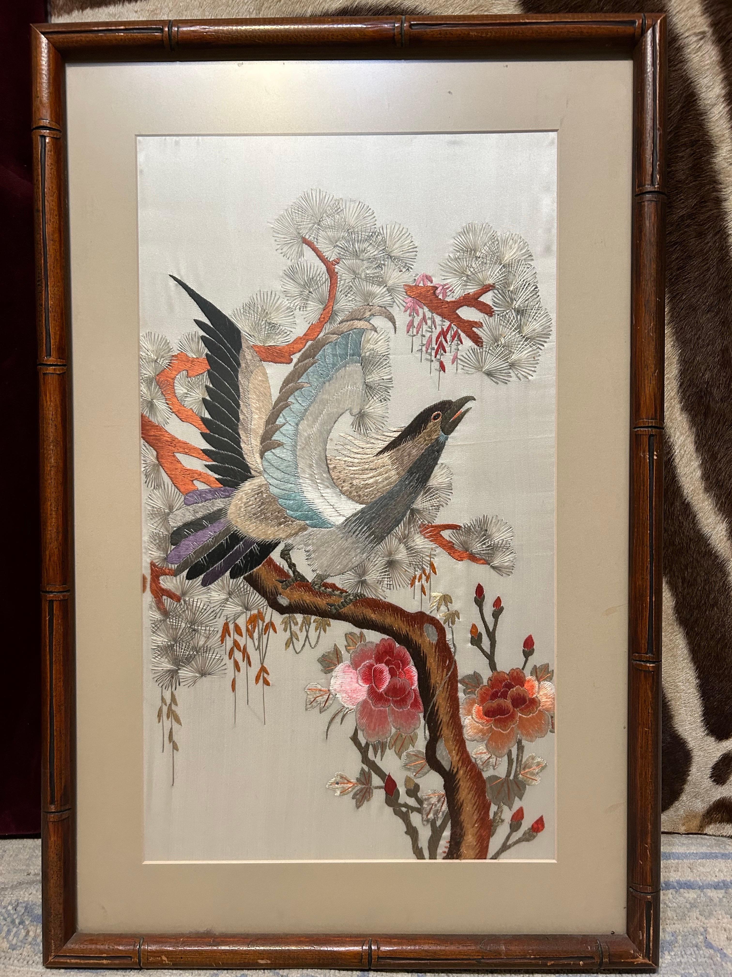 Expertly embroidered in silk in soft luxurious hues. The subject matter speaks for itself. A bird about to take off from a garden branch. The colours are exquisite. A good size and conversation piece beautifully encased in an oriental frame.
