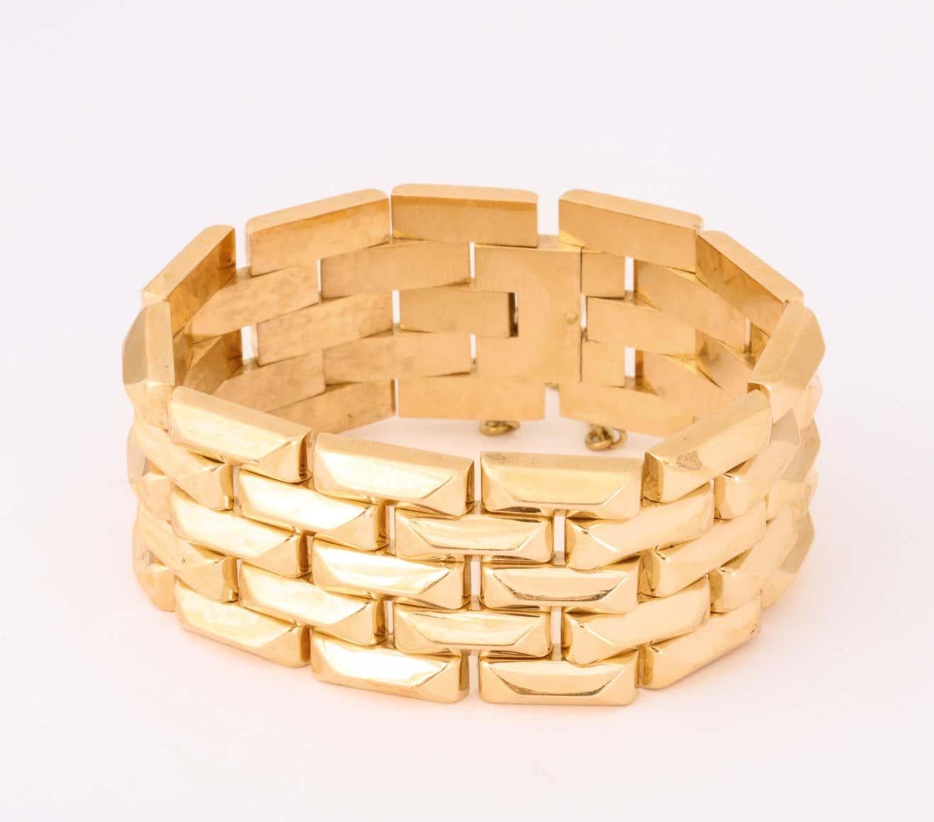 One 18kt Buttery Yellow Gold High Polish Link Bracelet Consisting Of Five Rows Of Numerous Pyramid Block Design Flexible Pieces. This Bracelet Is Created In The 1940's-1950's Era.
