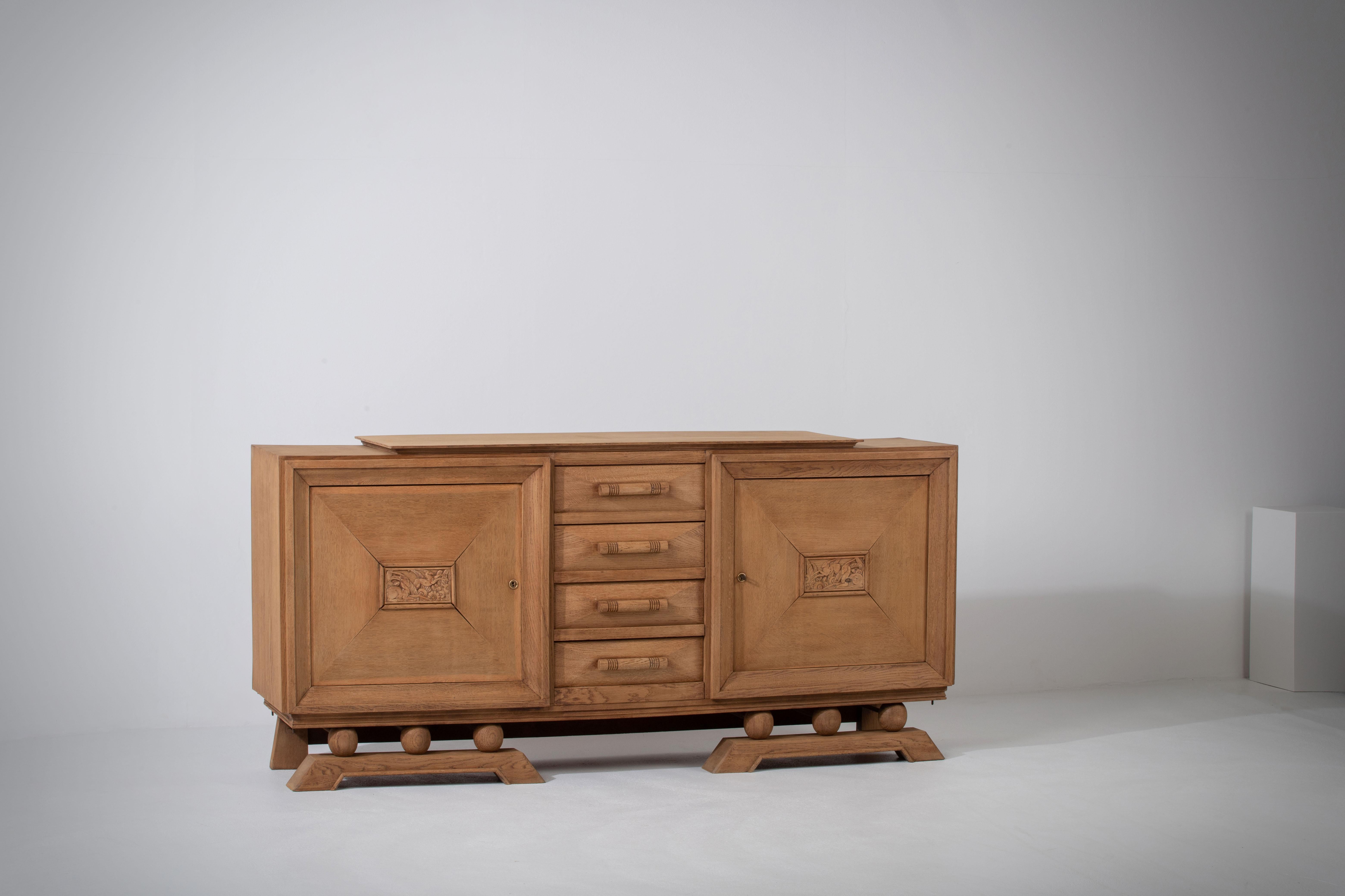 Introducing a stunning 1940s Brutalist sideboard, expertly crafted in France from natural oak. This exceptional piece embodies the captivating fusion of strength and elegance that characterizes the Brutalist style. Its exquisite design features