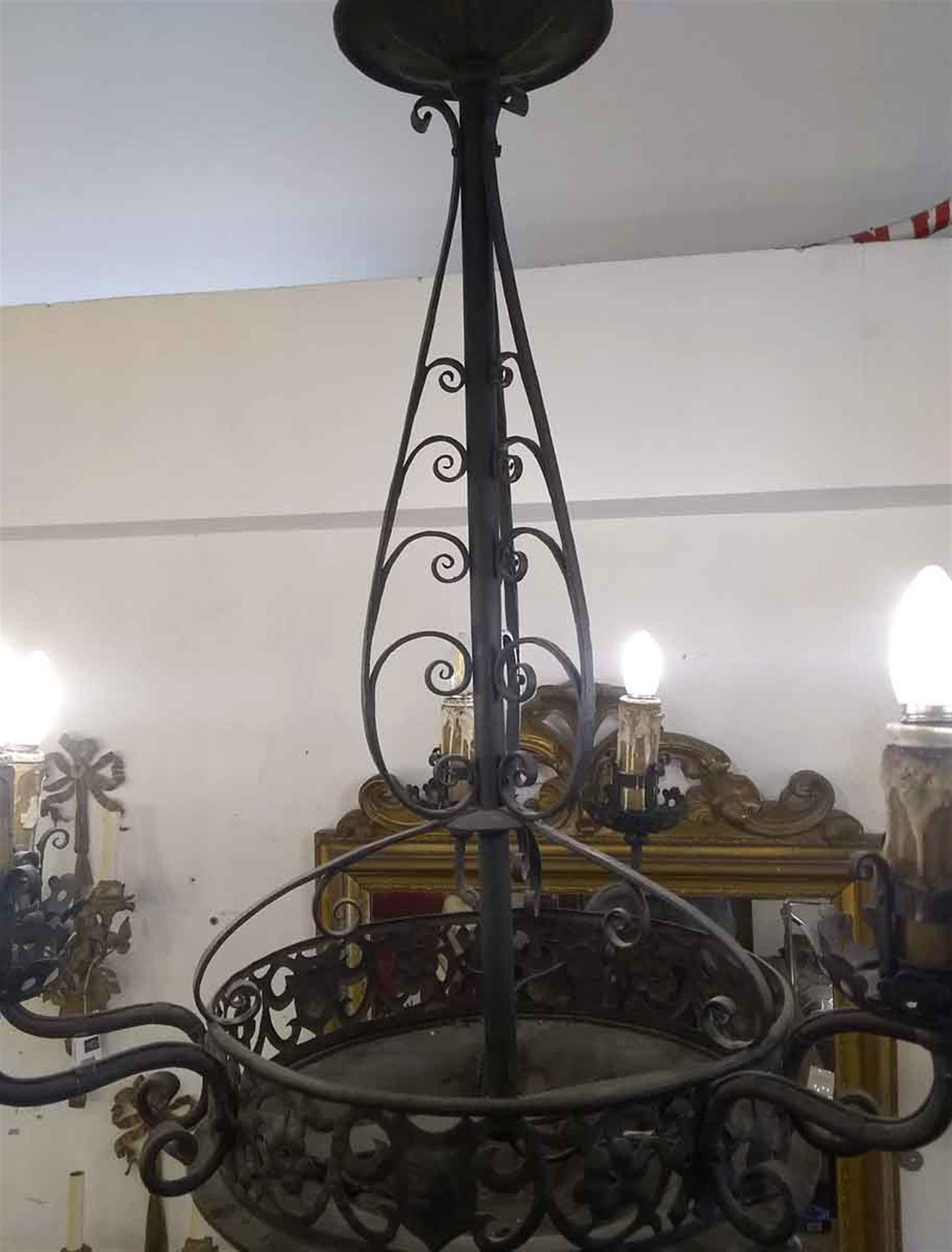 Wrought iron chandelier with turned curl details, six arms and a black finish from 1940s France. Please note, this item is located in our Scranton, PA location.