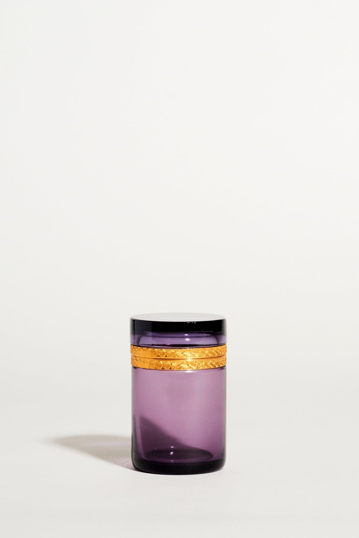 1940s French amethyst glass jewelry pot with hinged lid and finely detailed shell pattern on the gold trim.