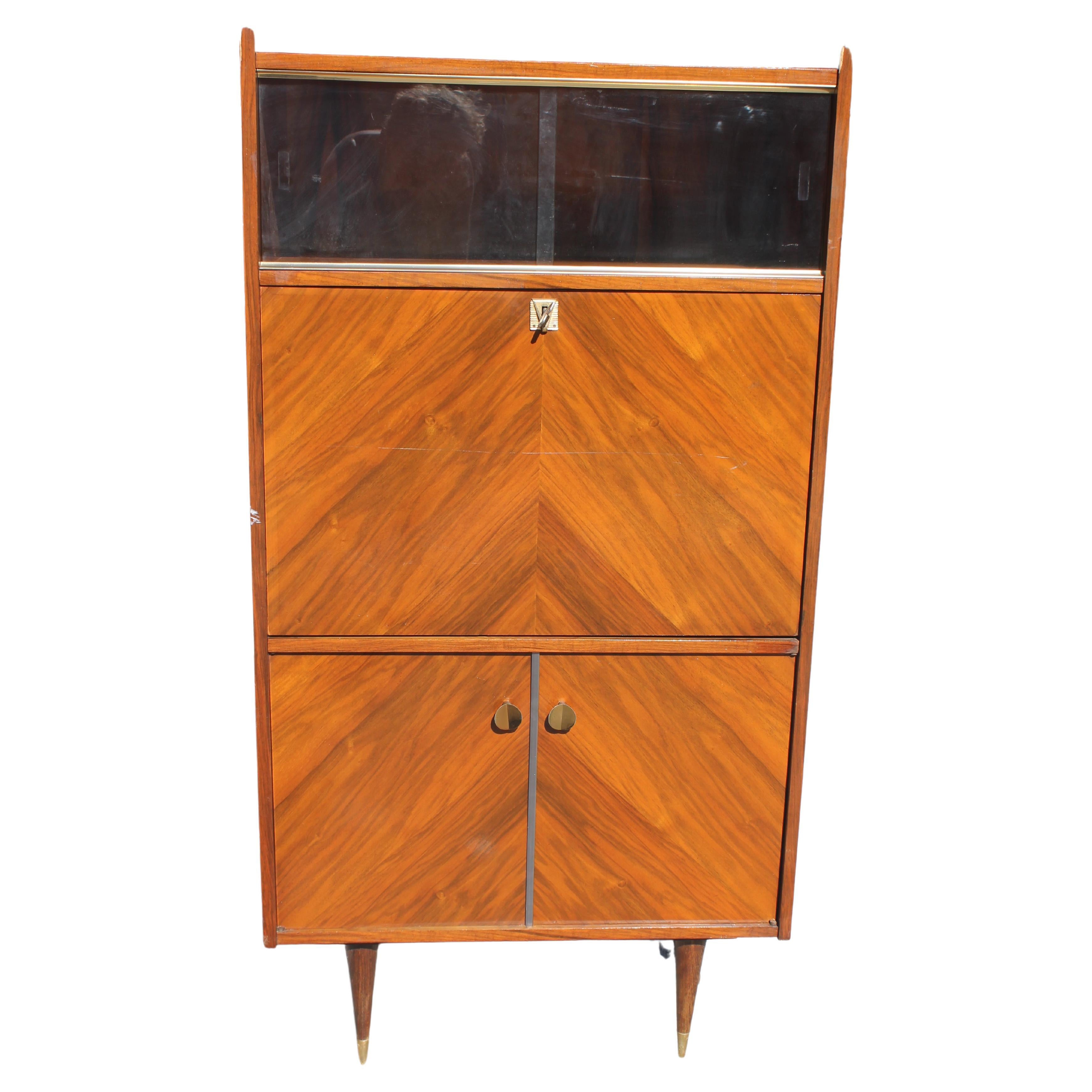 c1940's French Art Deco Exotic Rosewood Secretary Cabinet. Top glass enclosed display area. Interior with special sections for desk needs. Rare form.