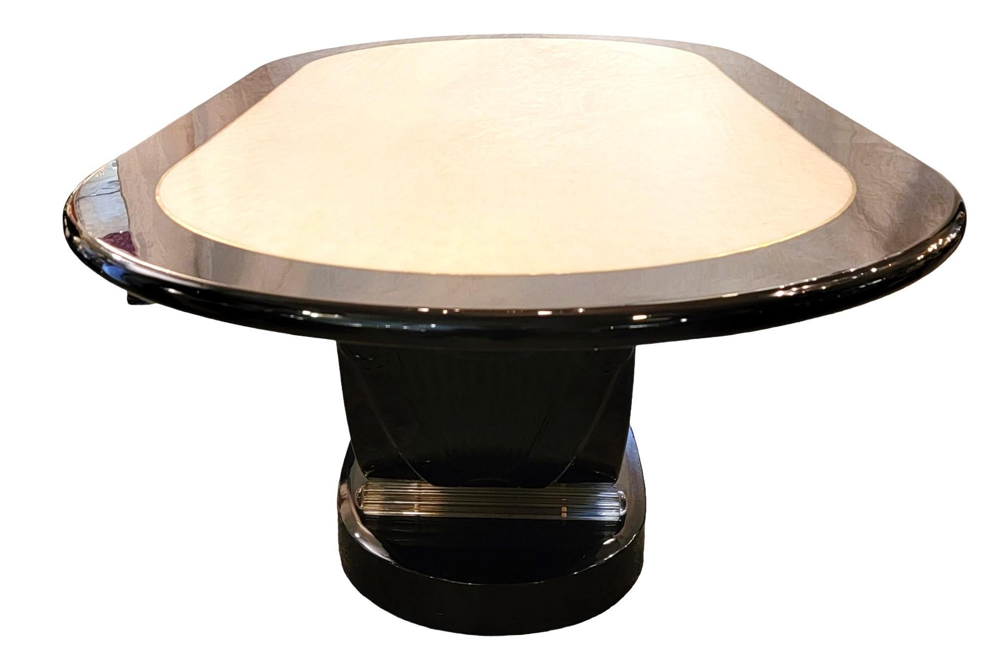 Oval wood lacquer and Lucite conference table.
The top of the table offers a white and black lacquered top. The top of the table has a feathered peacock design which offers a wonderful sense of relaxation. The white is contrasted throughout the