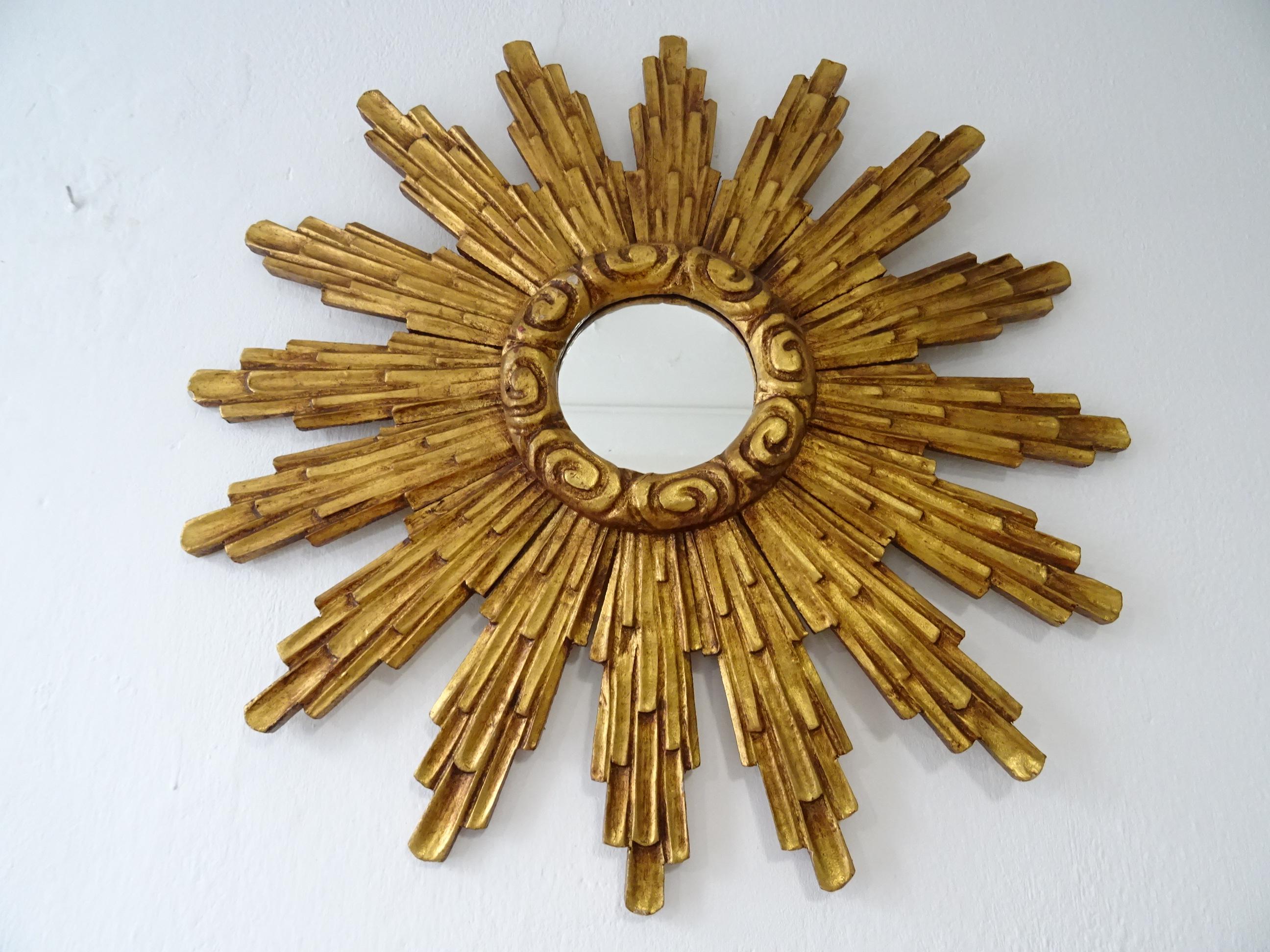 Beautiful big French wood gold starburst. Amazing patina. Gold wood with mirror in perfect shape. Mirror itself measures 5 inches round. The wood is a bit convex, so mirror stands out a bit more than the end of rays. Free priority UPS shipping from