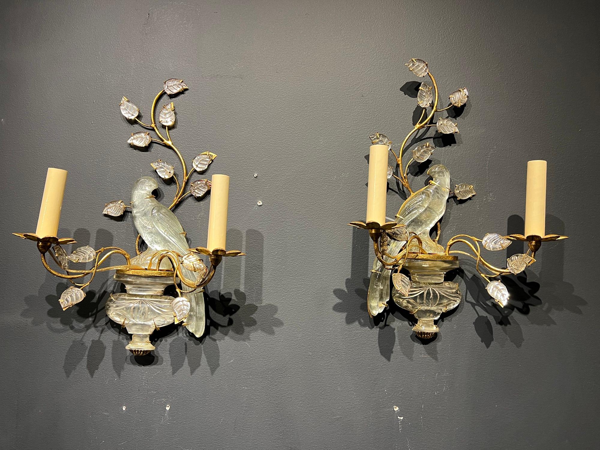 A pair of circa 1940’s French Bagues gilt metal and crystal bird sconces with glass leaves