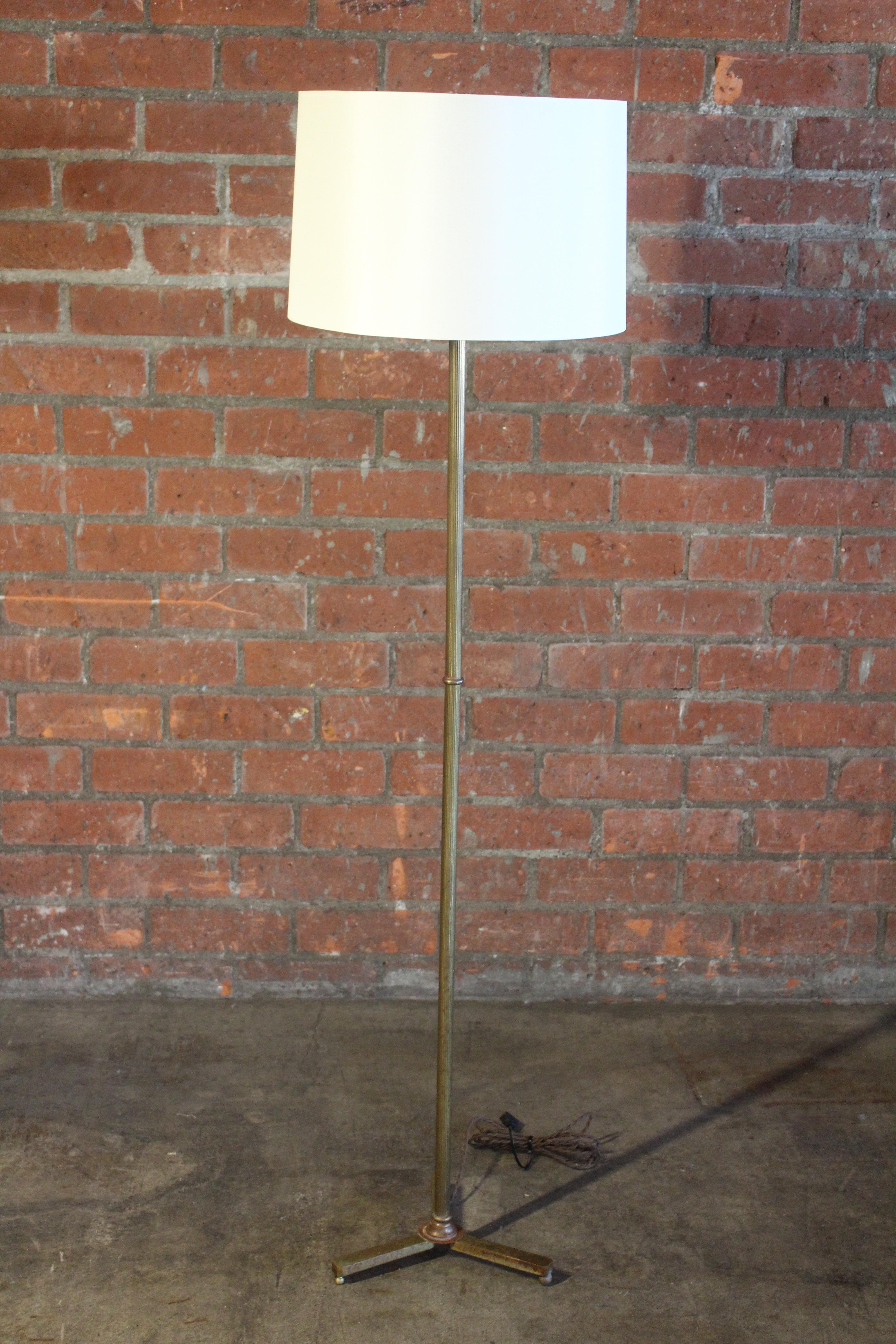 A vintage brass floor lamp, France, 1950s. Recently rewired and fitted with a custom shade in silk. The base is 12