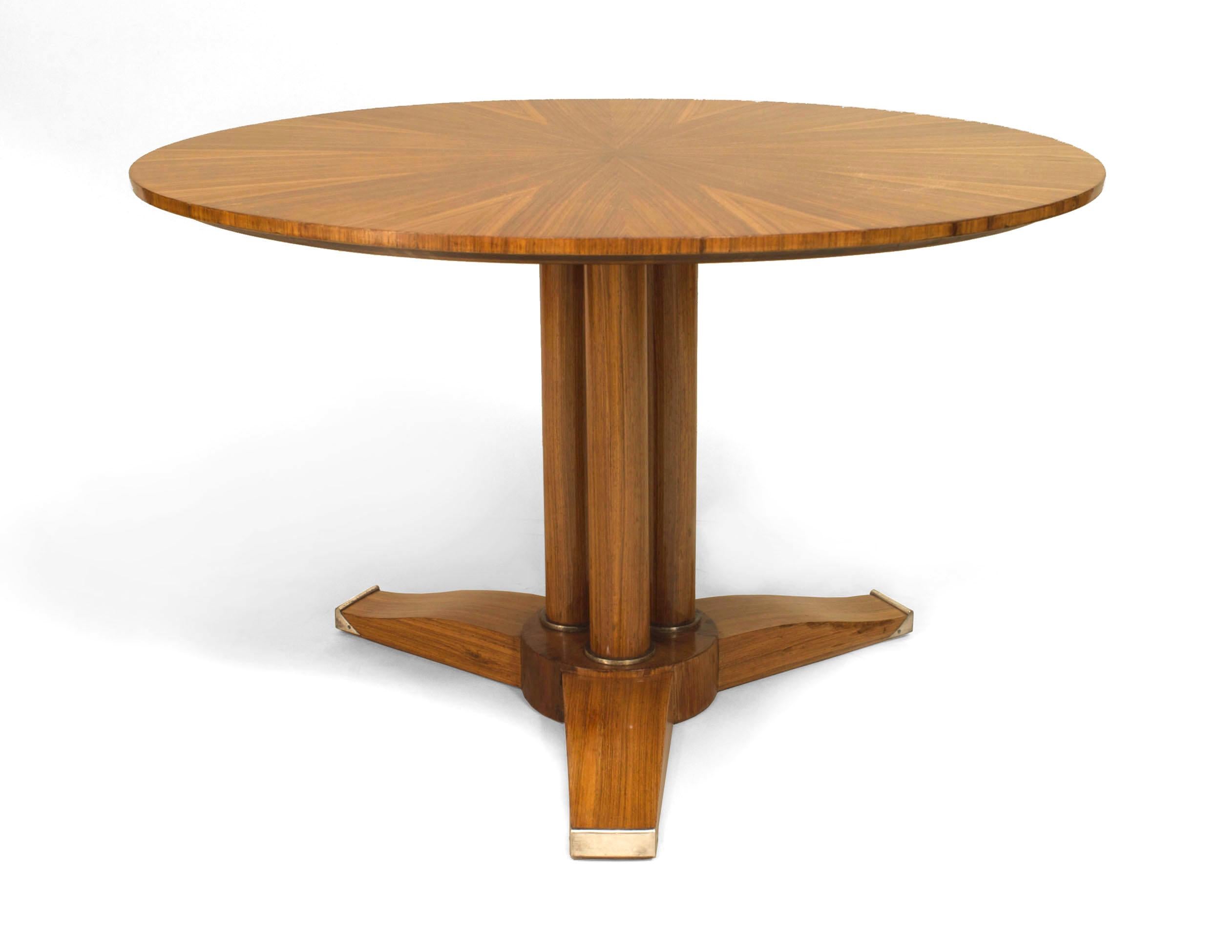 French Mid-Century (1940s) blond mahogany coffee table with a round sunburst design top supported on a three-column base with bronze trim and three flat feet. (JULES LELEU)
