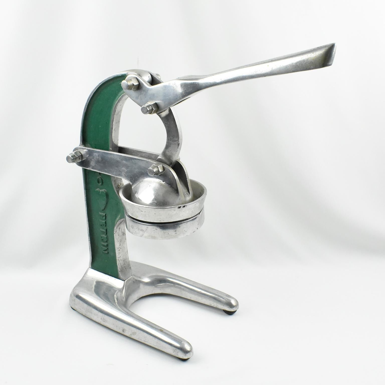 Stunning 1940s lemon squeezer or juicer. Heavy duty mechanical barware tool, that almost looks like a torture machine!
Industrial tabletop citrus press was used in cafes and restaurants in France, made of cast aluminum with green enameling, the