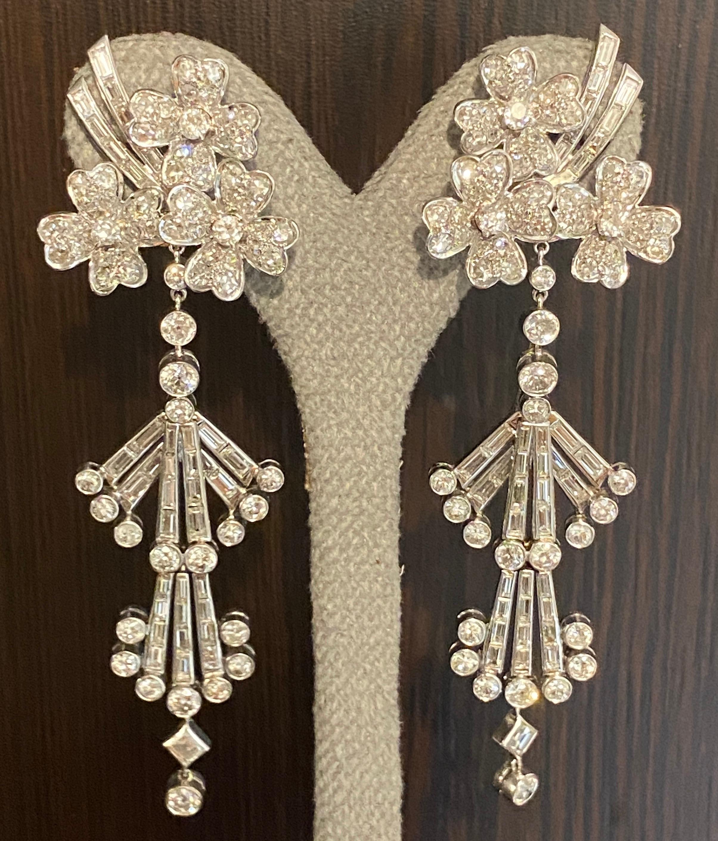 This beautiful example of Art Deco platinum and diamond chandelier earrings can be worn in two styles. As shown in the photos below, the long dangly extensions to the earrings can easily be detached to leave a stunning stud alternative. Both styles