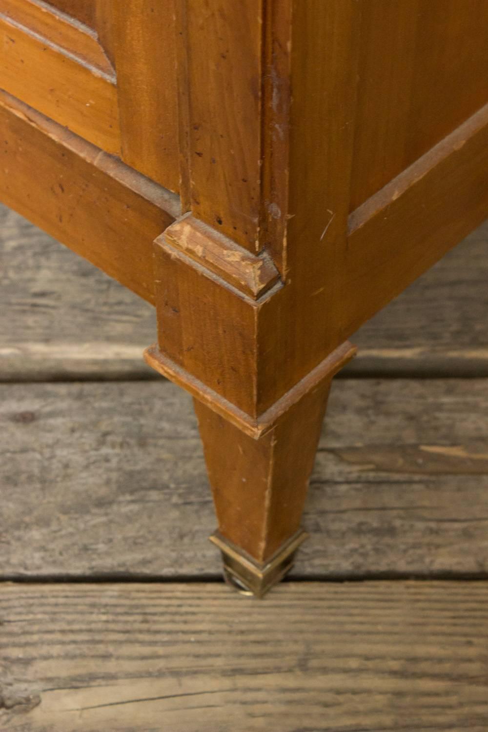 French small 1940s cherry armoire with lozenge patterned boxwood inlays. Two doors and brass sabot and hardware. In need of polishing but in good condition. Sold as is.
 