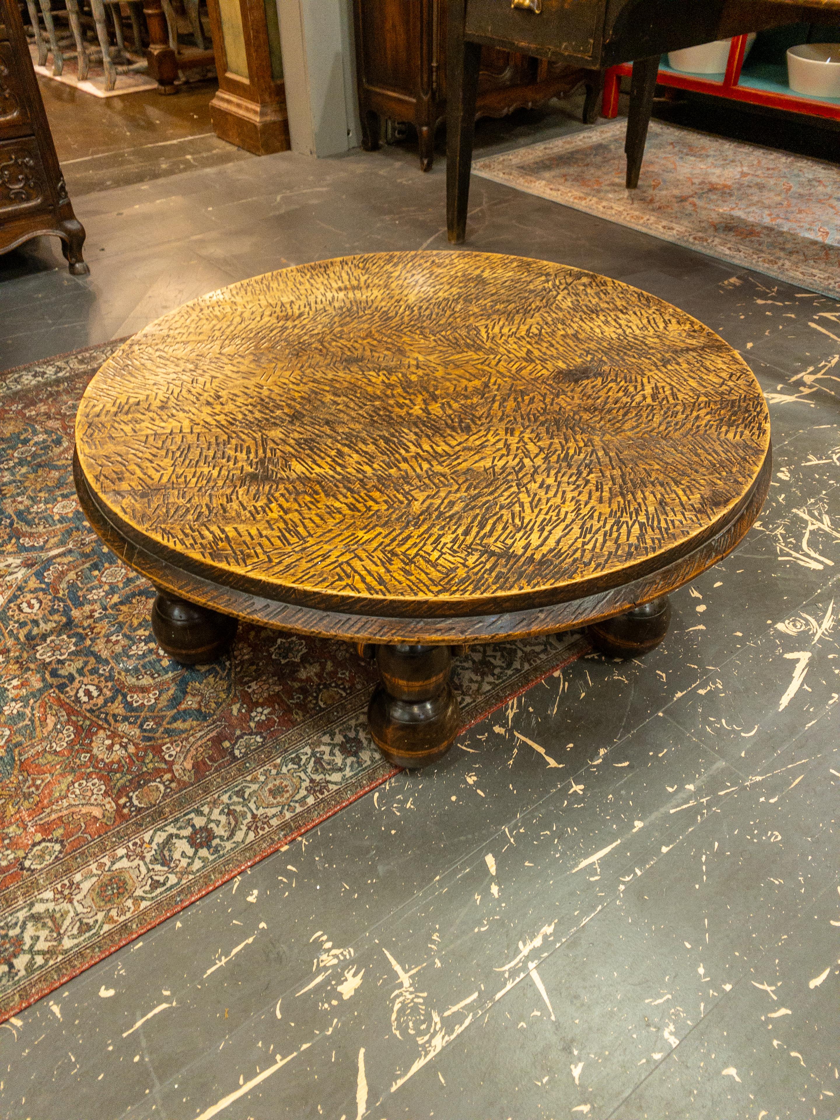 The 1940s French Coffee Table exudes a timeless elegance that captures the essence of its era. Crafted with meticulous attention to detail, its rounded legs evoke a sense of graceful sophistication, reminiscent of the Art Deco style popular during