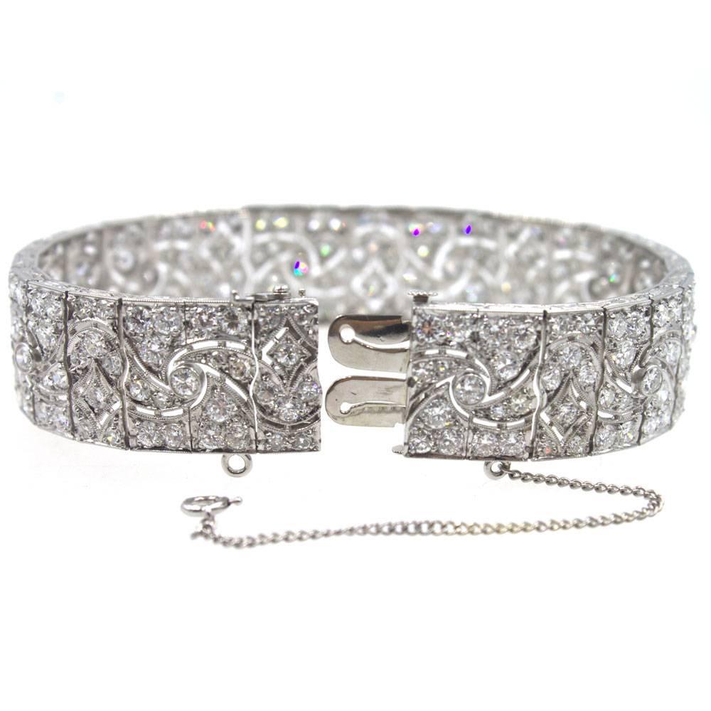 This fabulous French Deco diamond bracelet is circa 1920's. Hand crafted in platinum, the bracelet features 14 carats of high quality diamonds graded G-H color and VS-SI1 clarity. The bracelet measures 7.1 inches in length and .60 inches in width.