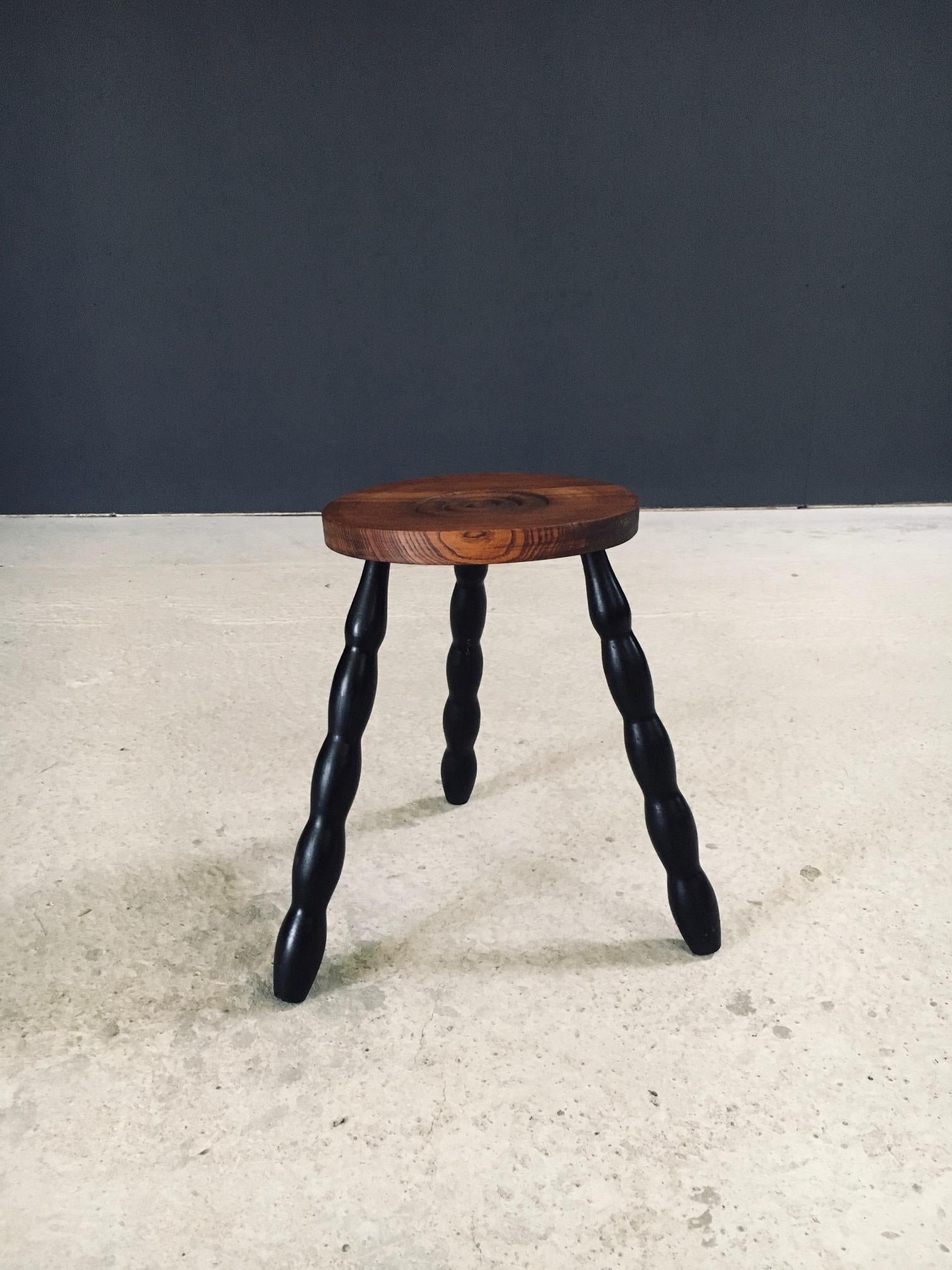 Vintage French Design Bobbin Tripod Stool in the manner of Charles Dudouyt. Made in France, 1940's / 50's period. Turned oak bobbin legs stained in black with an oak wood turned round seat with the typical Charles Dudouyt style circle motif. This