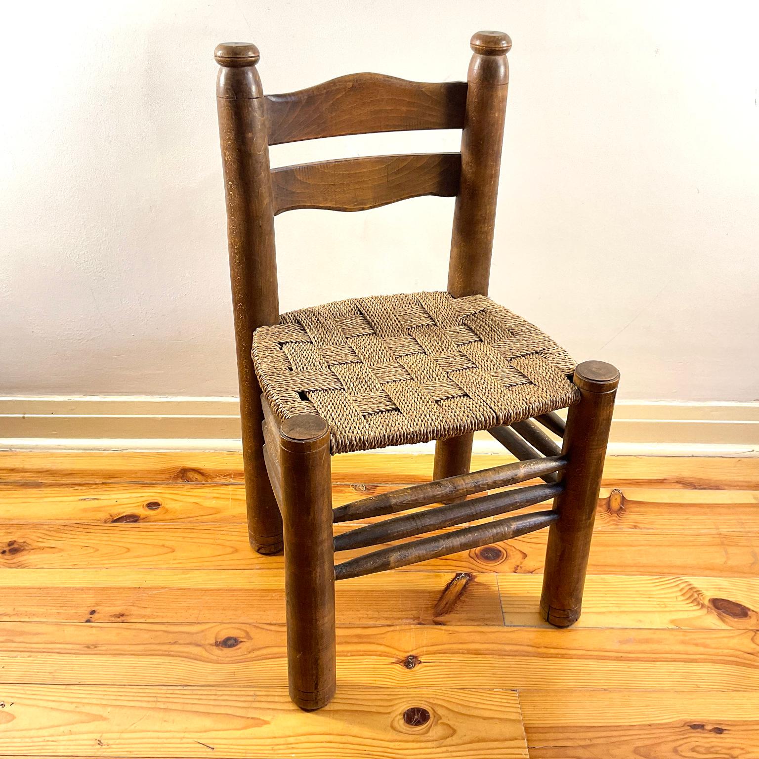 Single rustic dining chair by Charles Dudouyt with a natural rush weave.

