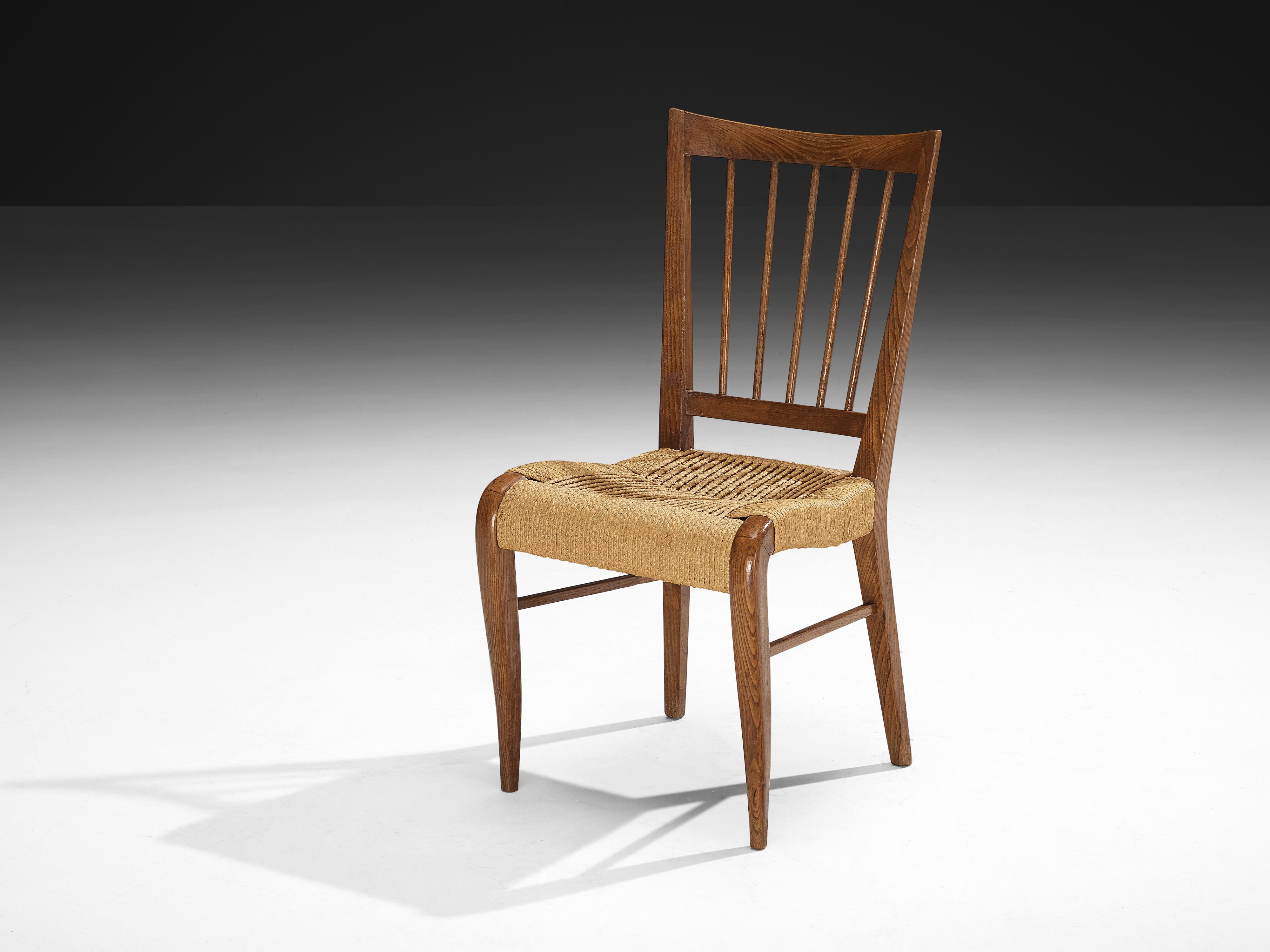 Dining chair, chestnut, rush, France, 1940s

This design serves as an example of how traditional materials were refined through subtle, modernist influences in the 1940s. Crafted from chestnut and rush, the chairs obtain a natural and understated