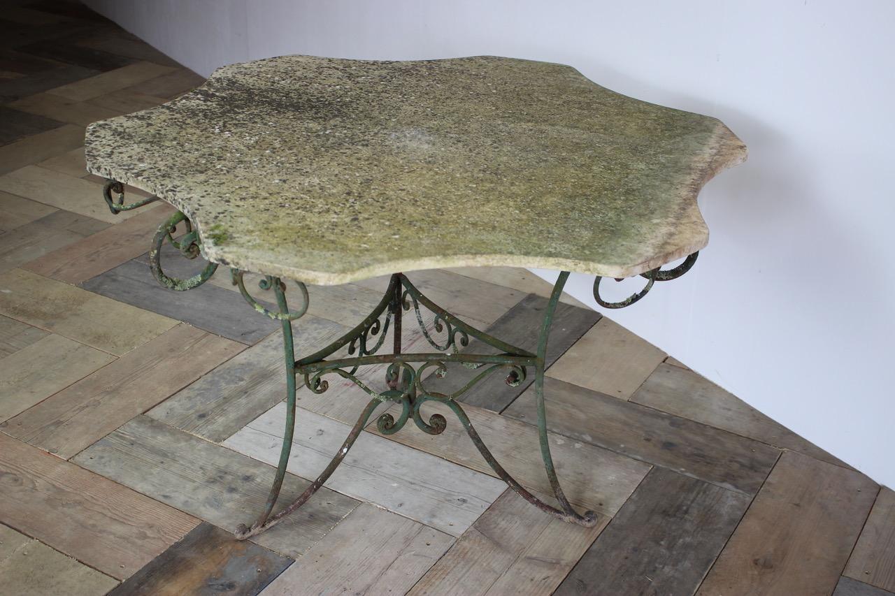A very charming, mid-20th century French garden table, with a marble top.