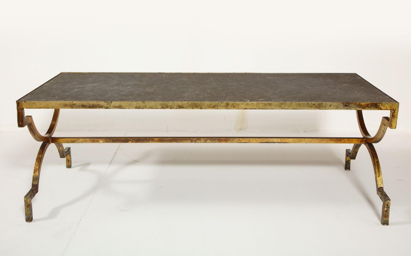 Midcentury French coffee table with gilded iron base and custom limestone top, circa 1940s.