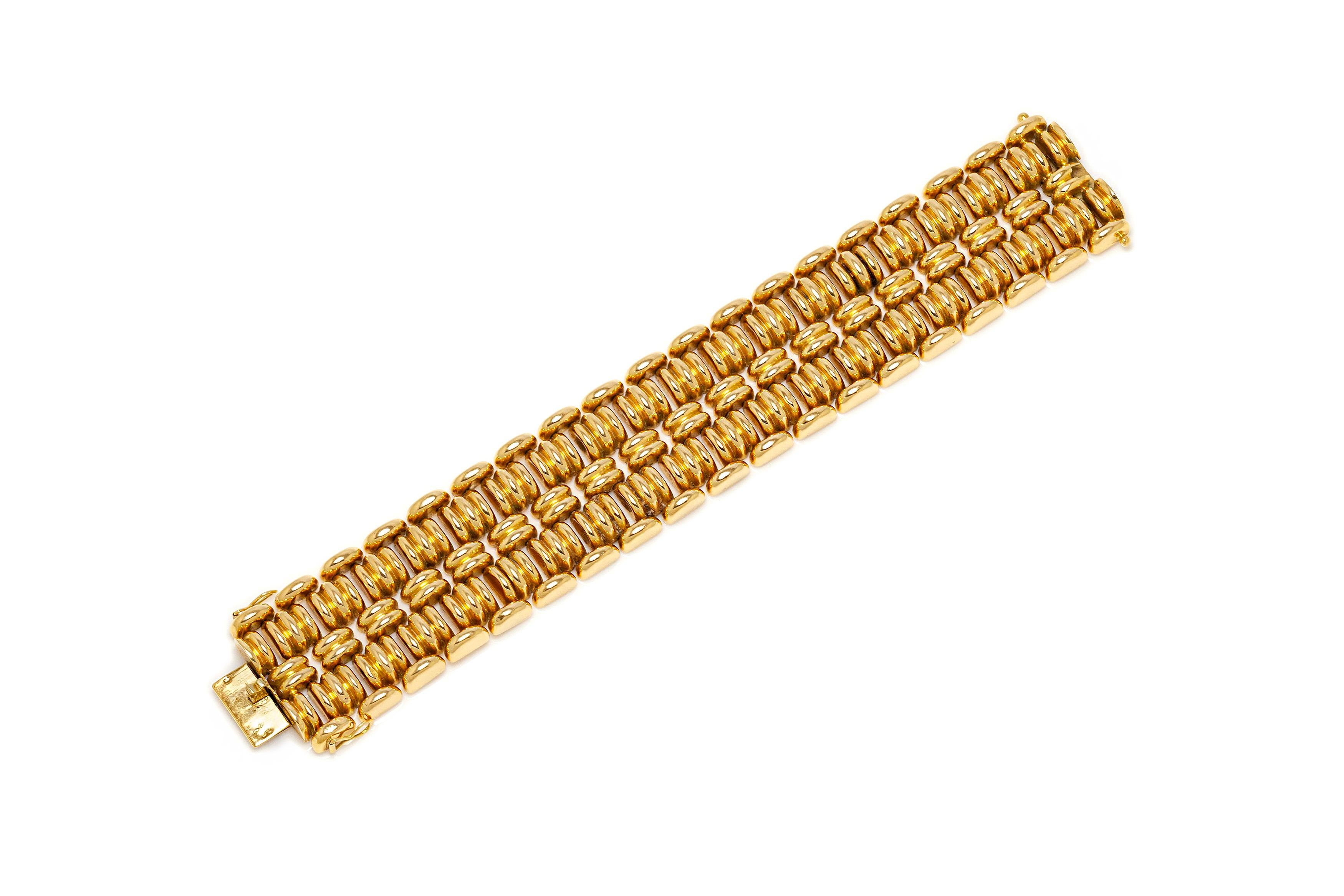 French bracelet finely crafted in 18k yellow gold weighing 68.2 dwt. Circa 1940's.