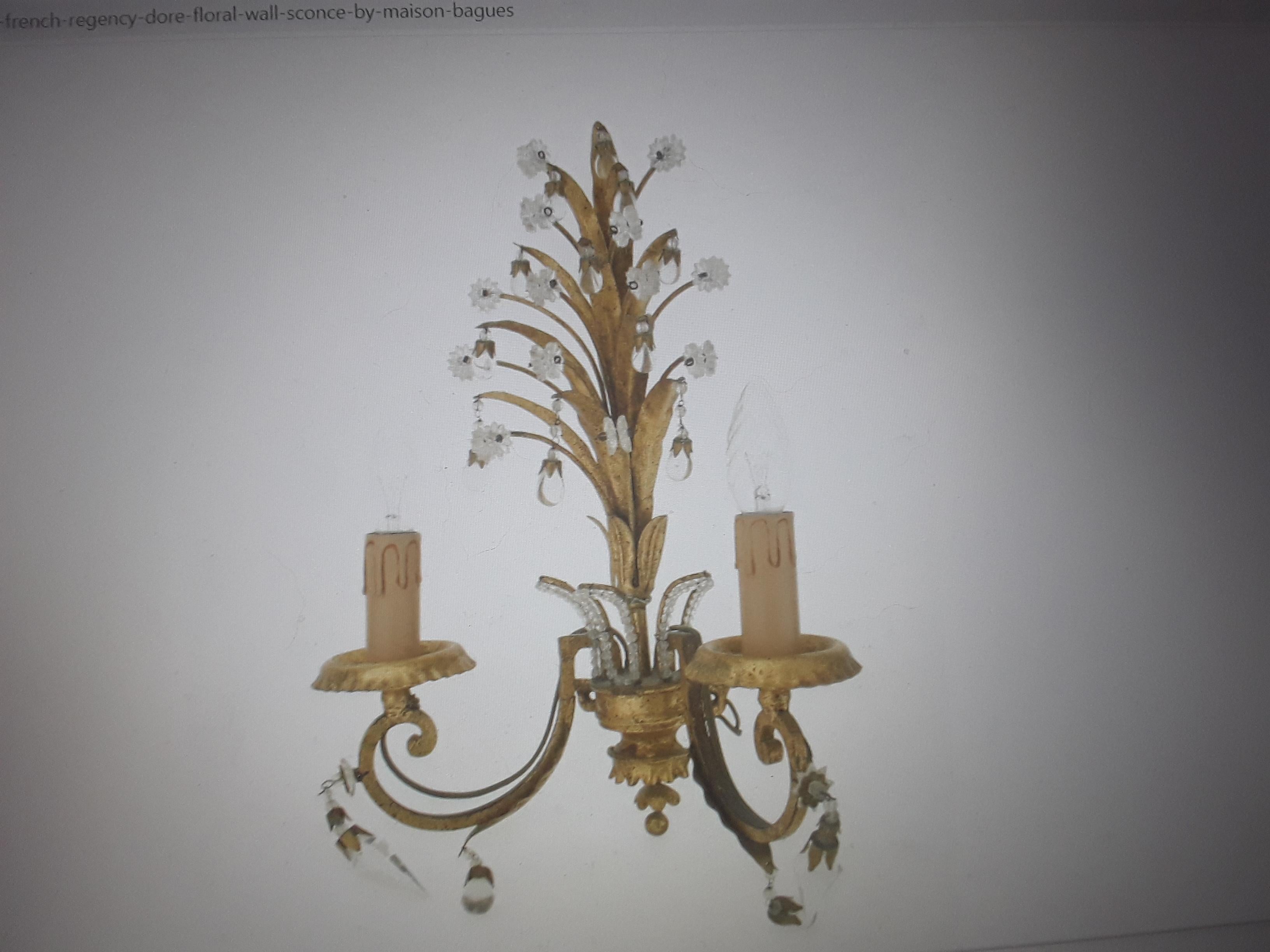 1940's French Hollywood Regency Gilt Metal Crystal Floral Form Wall Sconce. This beautiful wall lamp is attributed to Maison Bagues Paris.