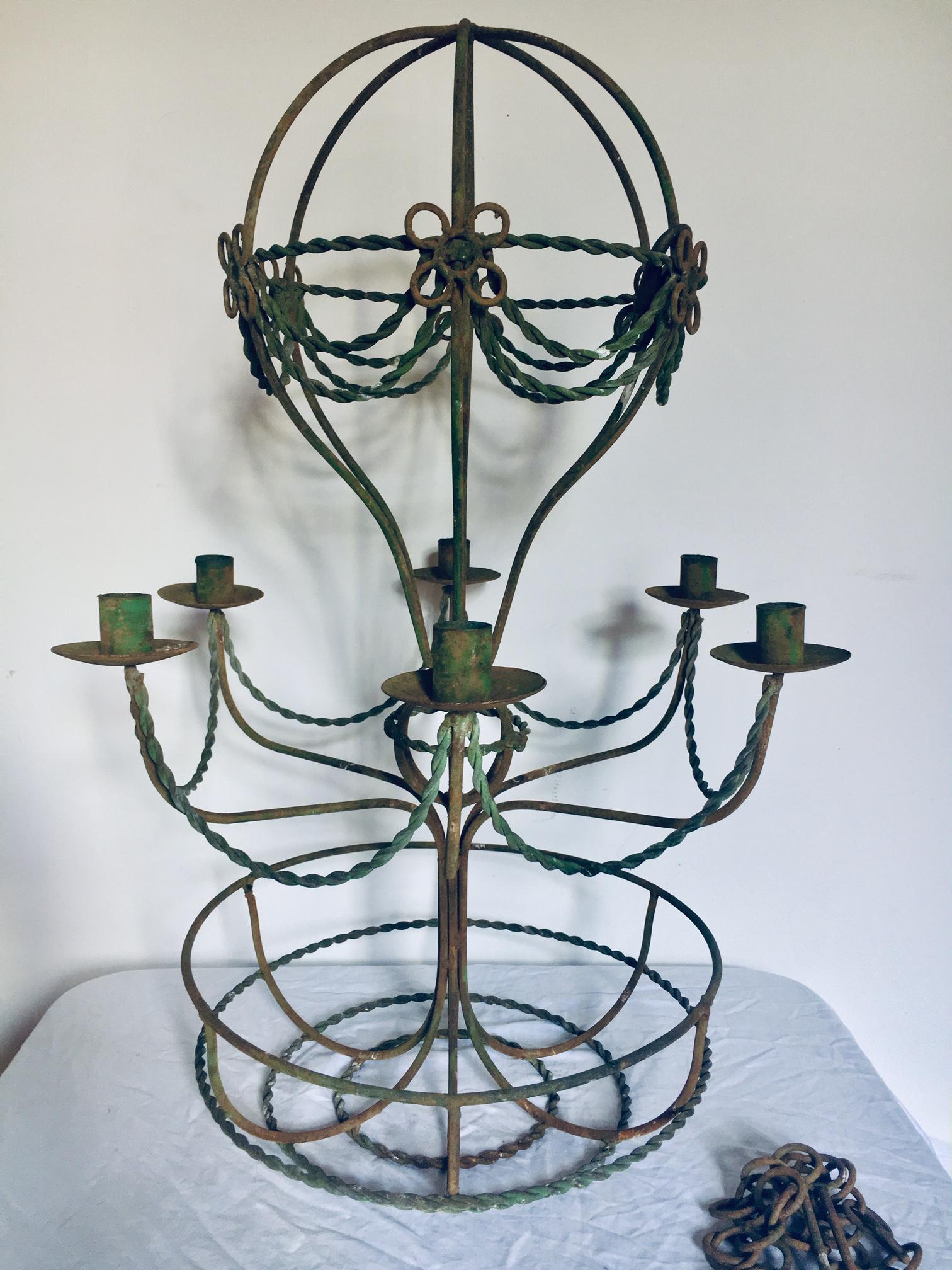 French 1940's Hollywood Regency Verde/ Green Iron Hot Air Balloon Chandelier. Candle Light, not electrified. There is some age wear to the green finish. Gives the piece character and is not detracting.